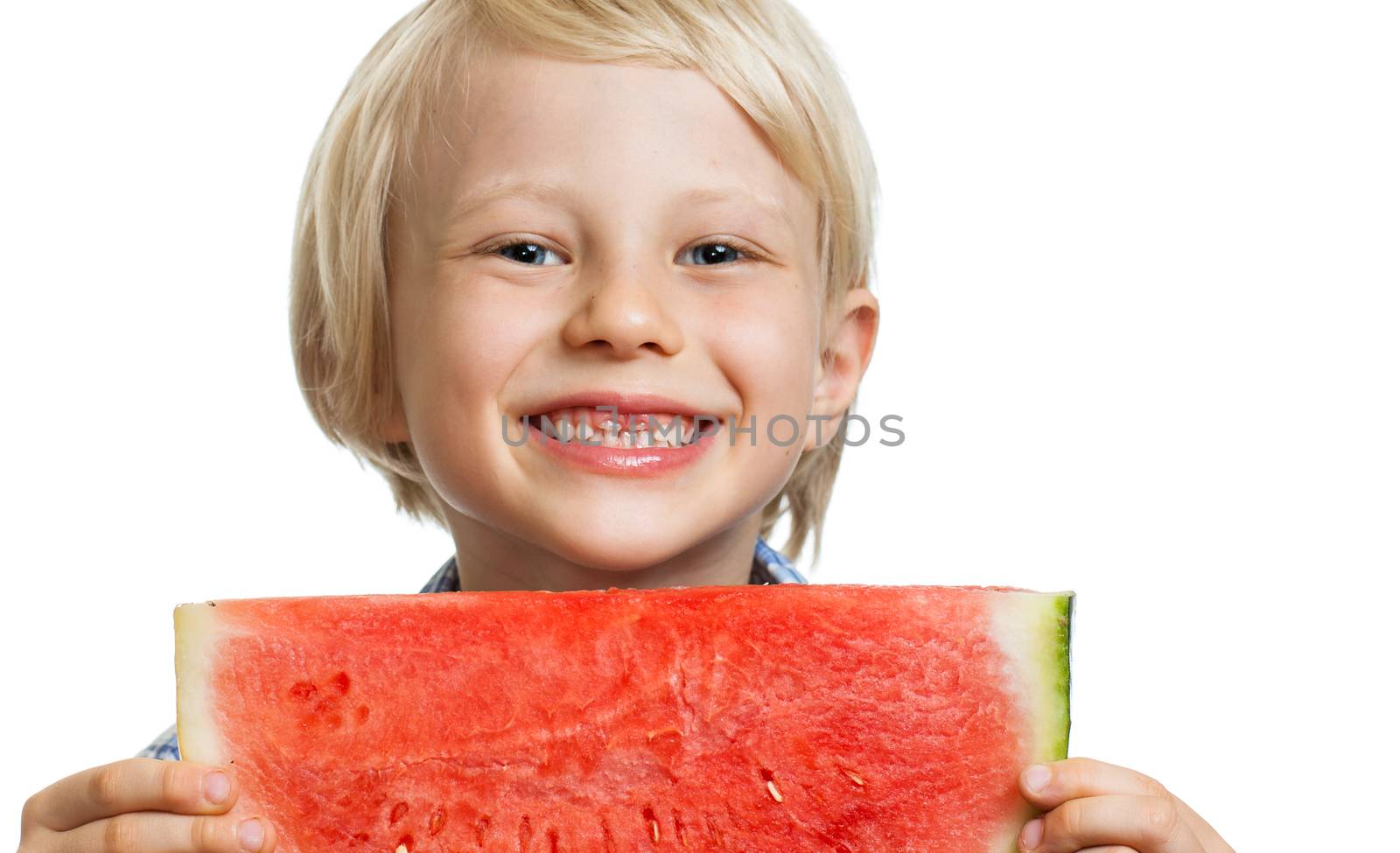 A cute laughing boy holding a juicy  slice of watermelon. Isolated on white.