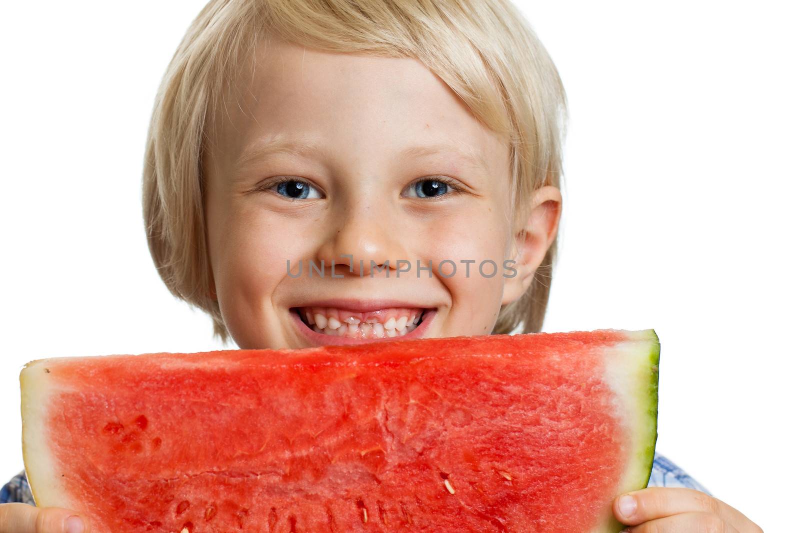 Close-up of a  cute happy smiling boy holding a big juicy slice of watermelon. Isolated on white.