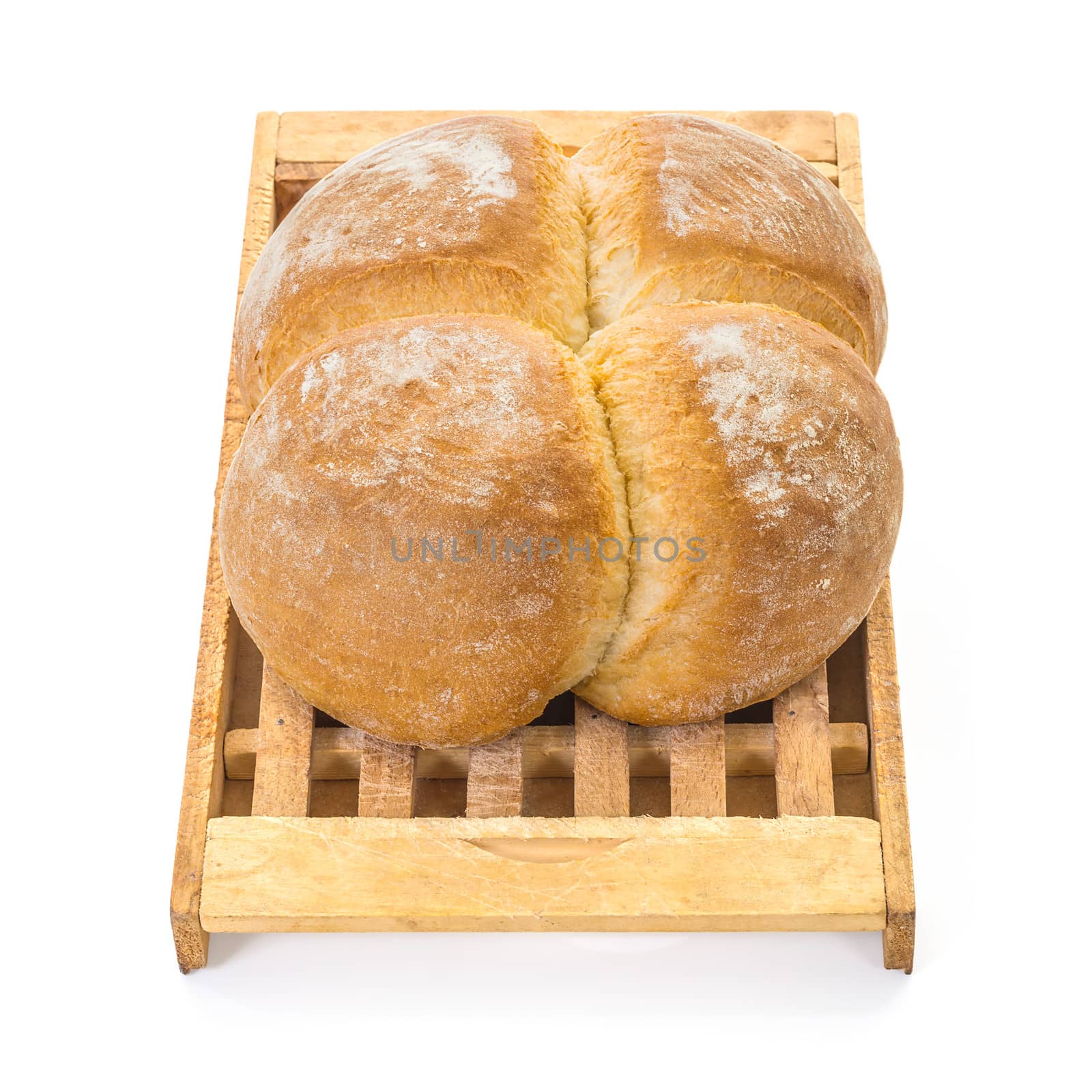 Four Buns Bread on Wooden Cutting Board over white background, Shallow focus