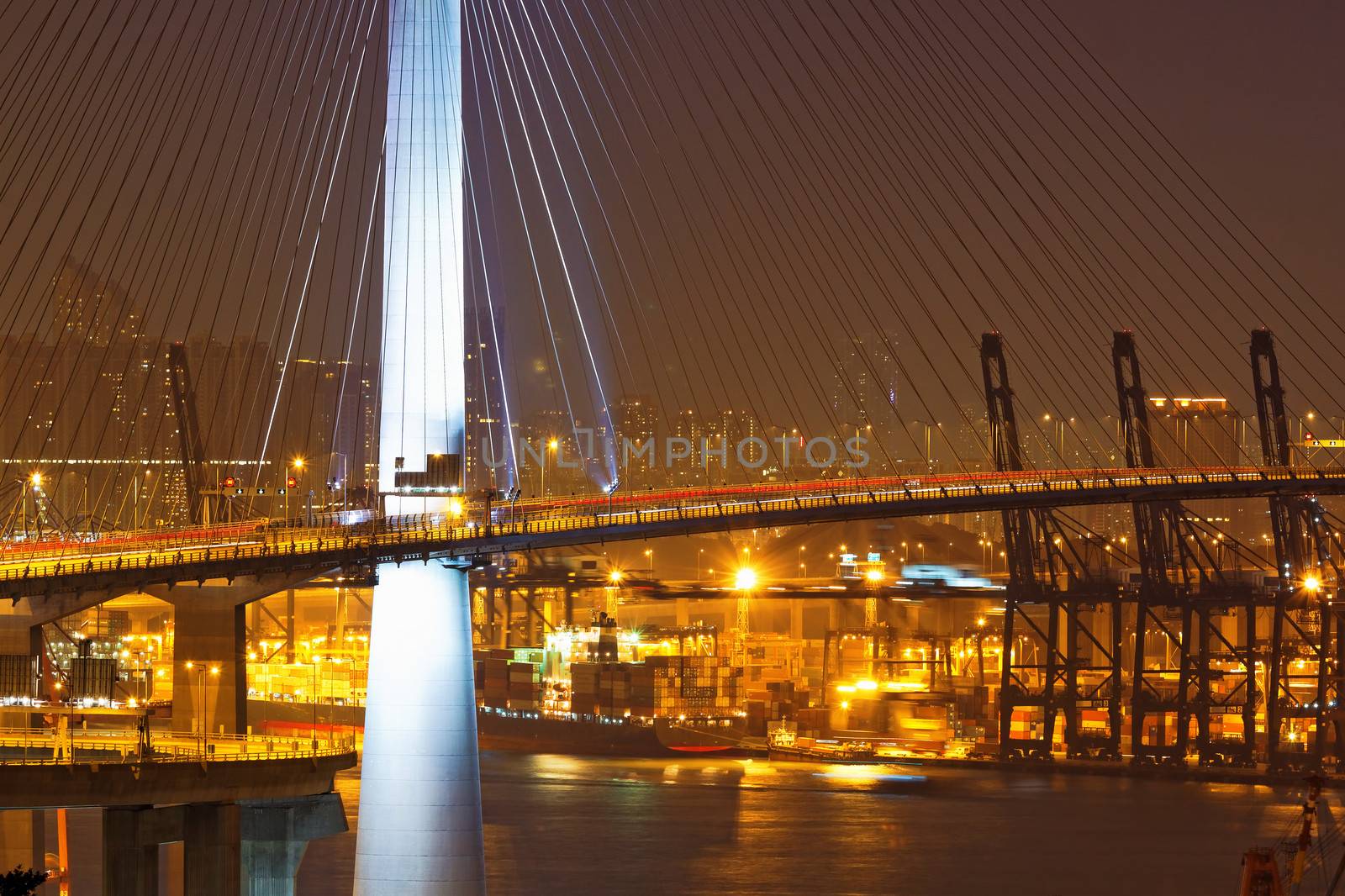 Freeway in night with cars light in modern city 