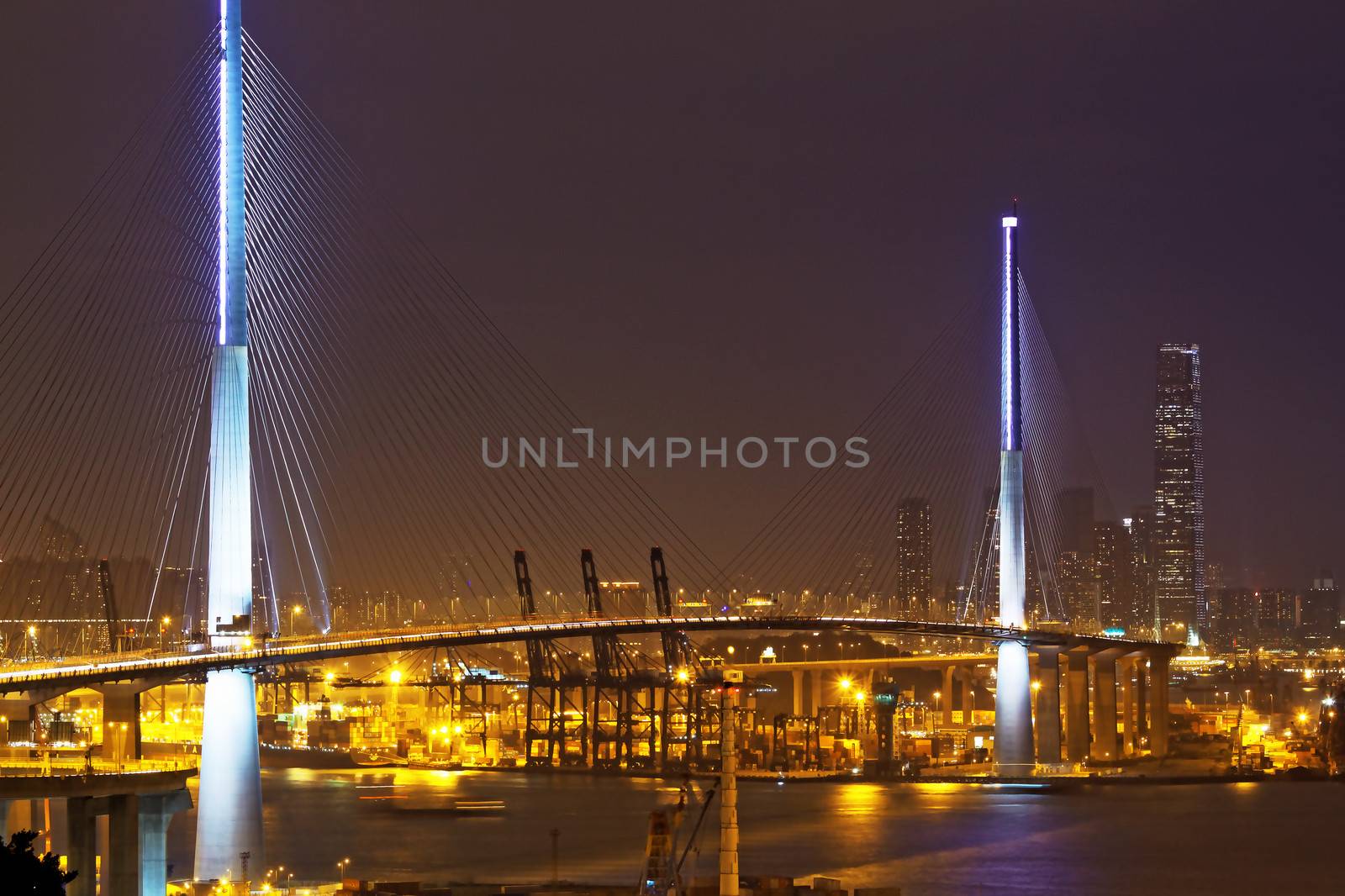 Freeway in night with cars light in modern city 