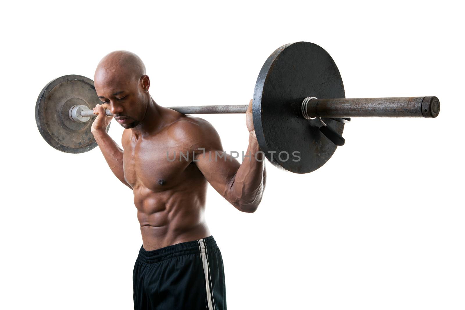 Toned and ripped lean muscle fitness man lifting weights isolated over a white background.