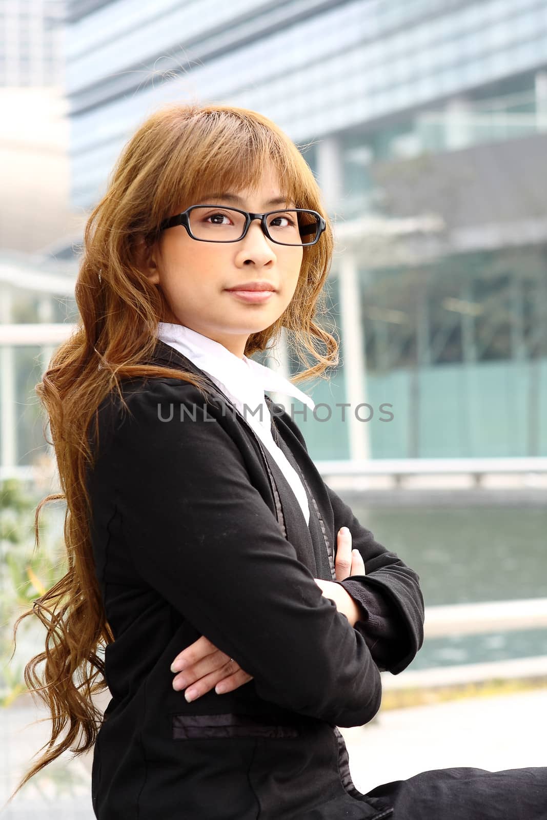 young business woman and an office background by cozyta
