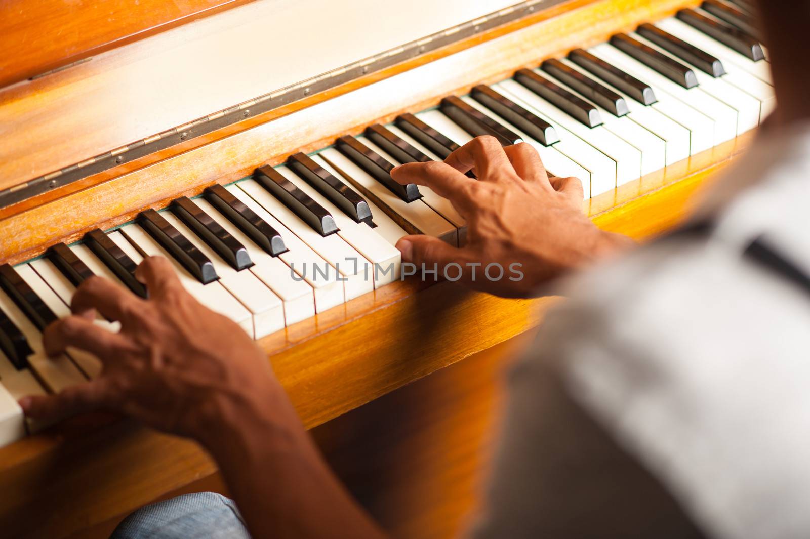 Pianist playing with selective focus on fingers