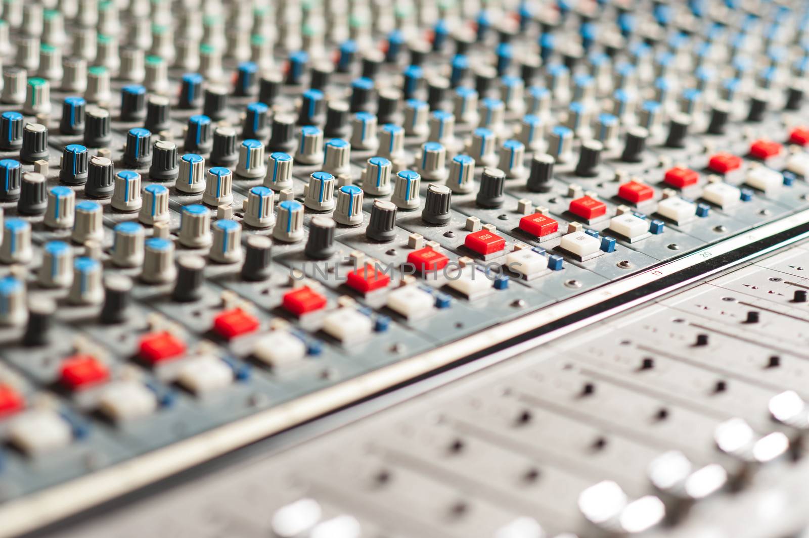 Closeup shot of audio mixer in recording studio