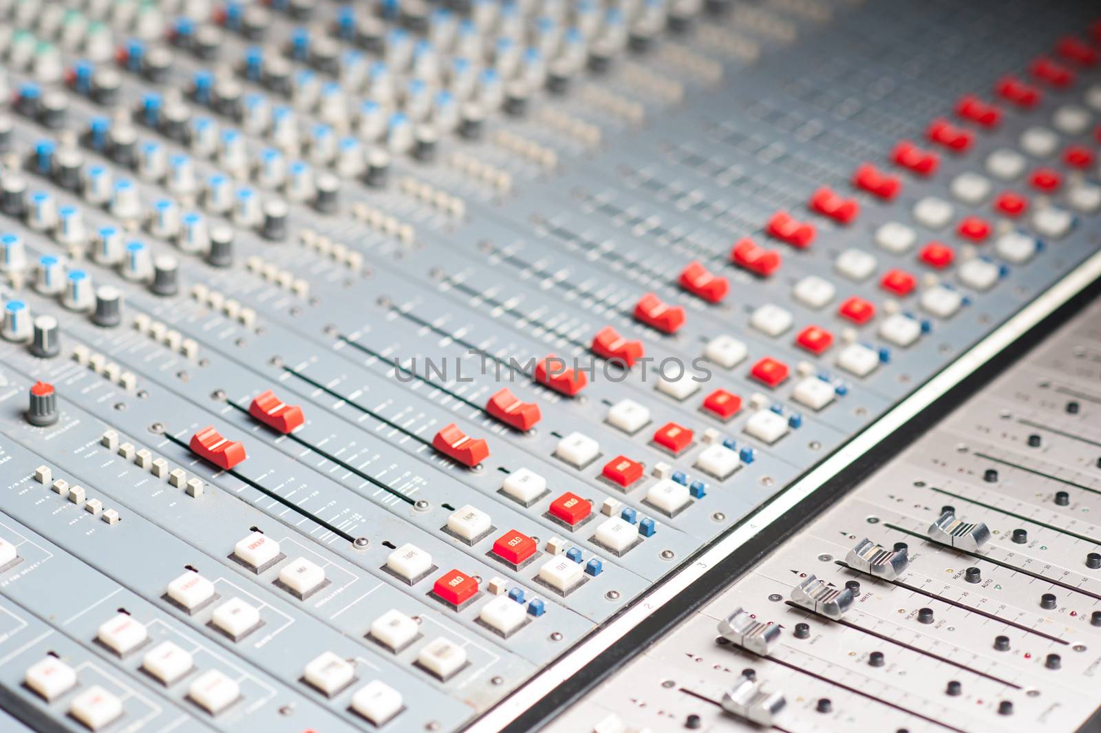 Sound mixer in recording studio, closeup.