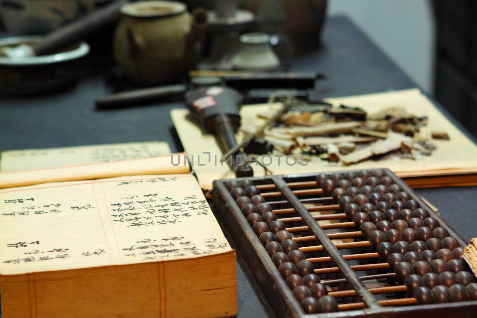 abacus and book on the table in a chinese old shop