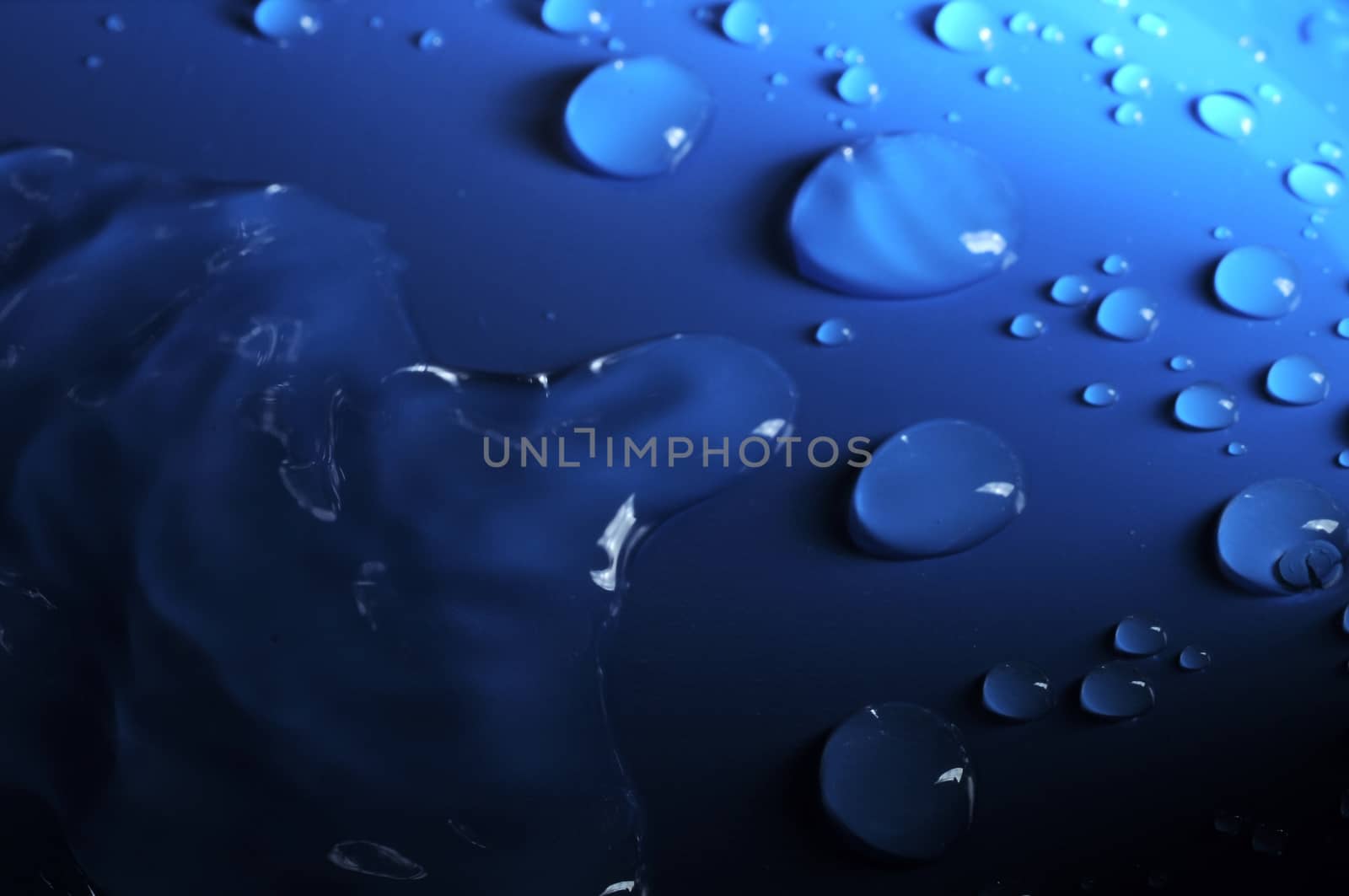 Some Water Drops on a Blue Textured Background