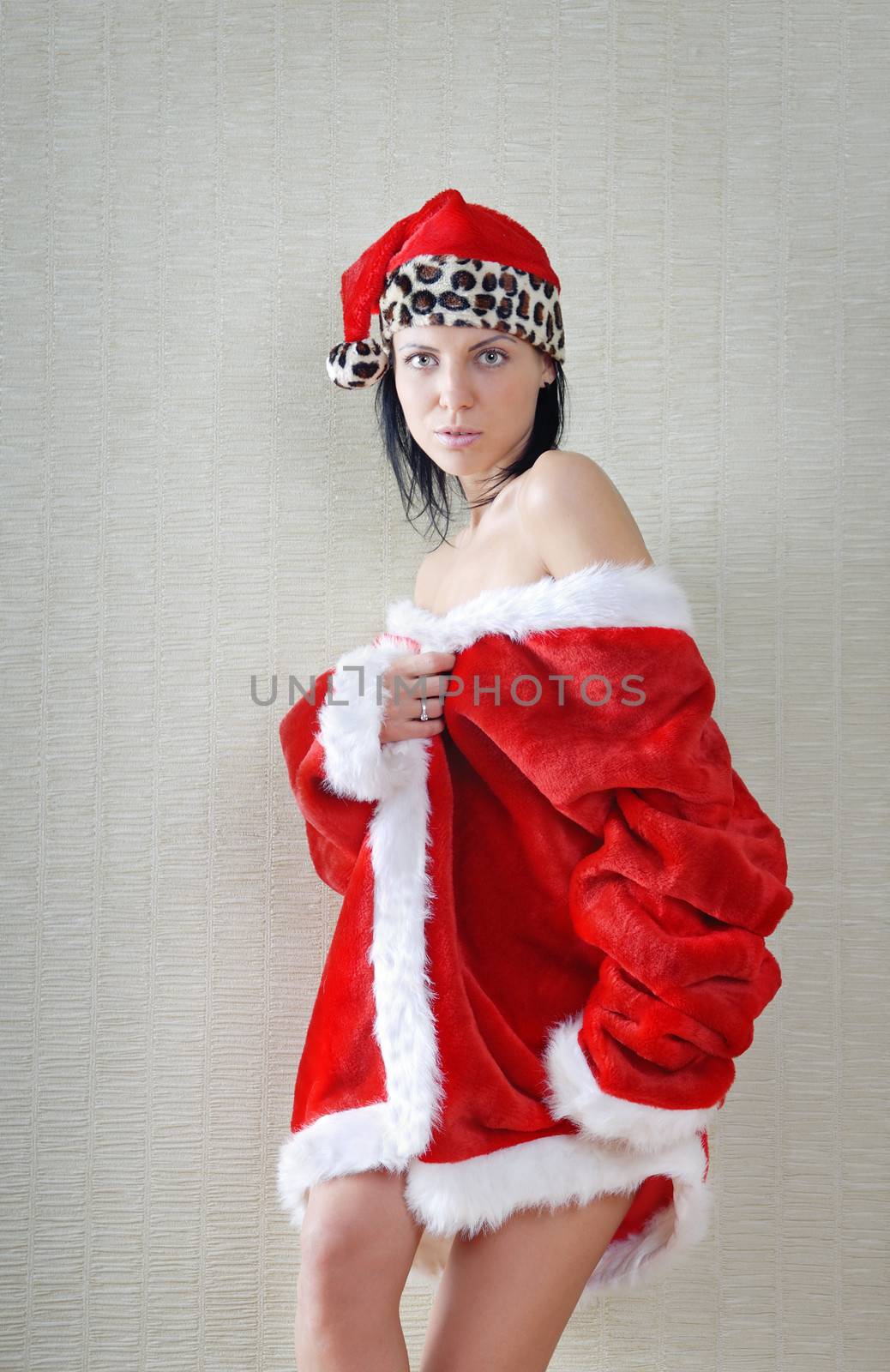 Glamour photo of the sexy lady in the red Santa costume