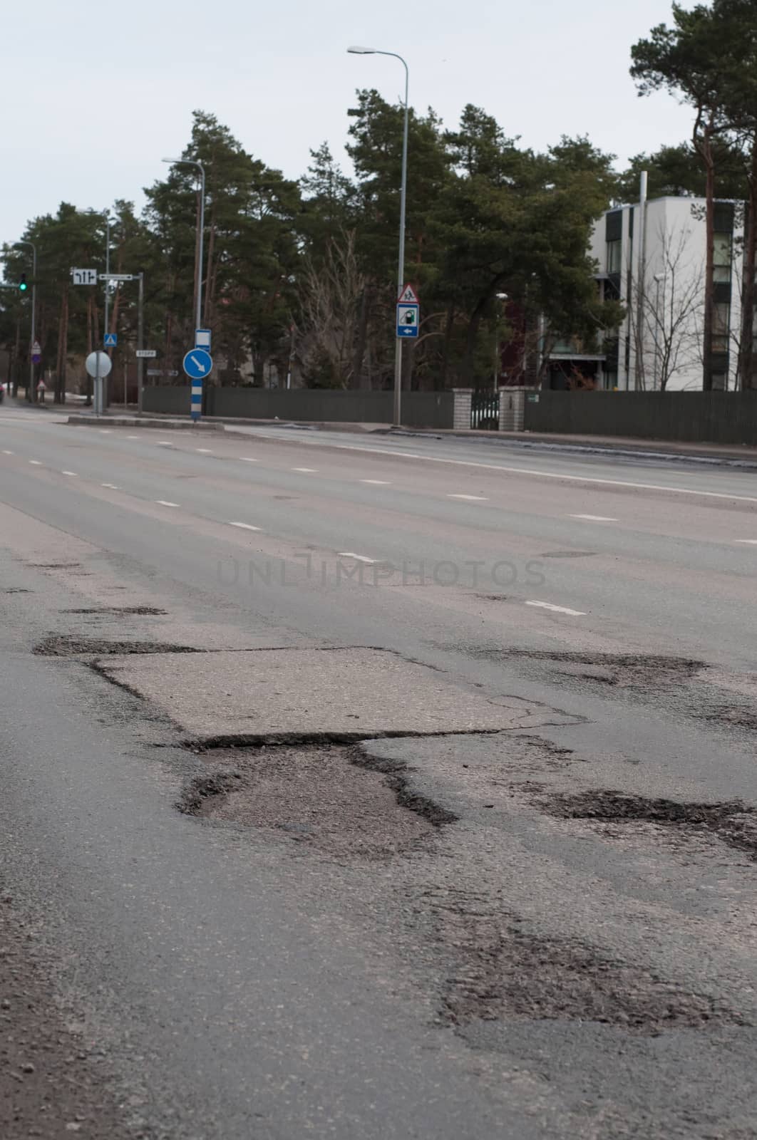 Shot of many potholes on the road