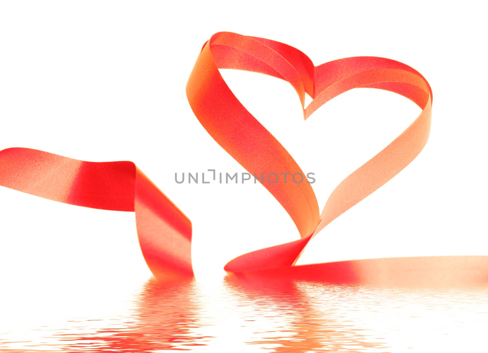 Close-up of the red ribbon heart flooded in water