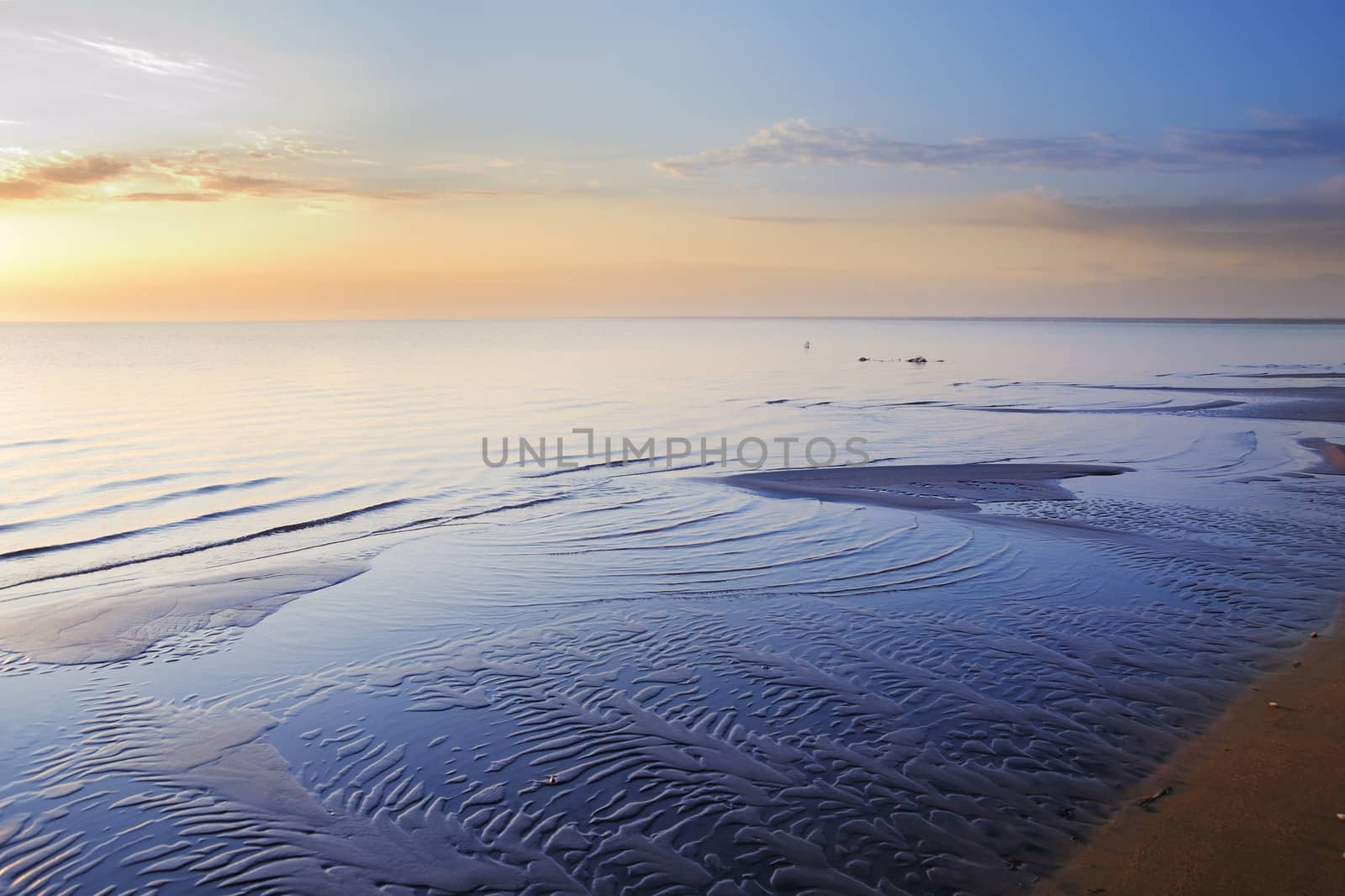 Photo of the sea coastline during sunrise in summer