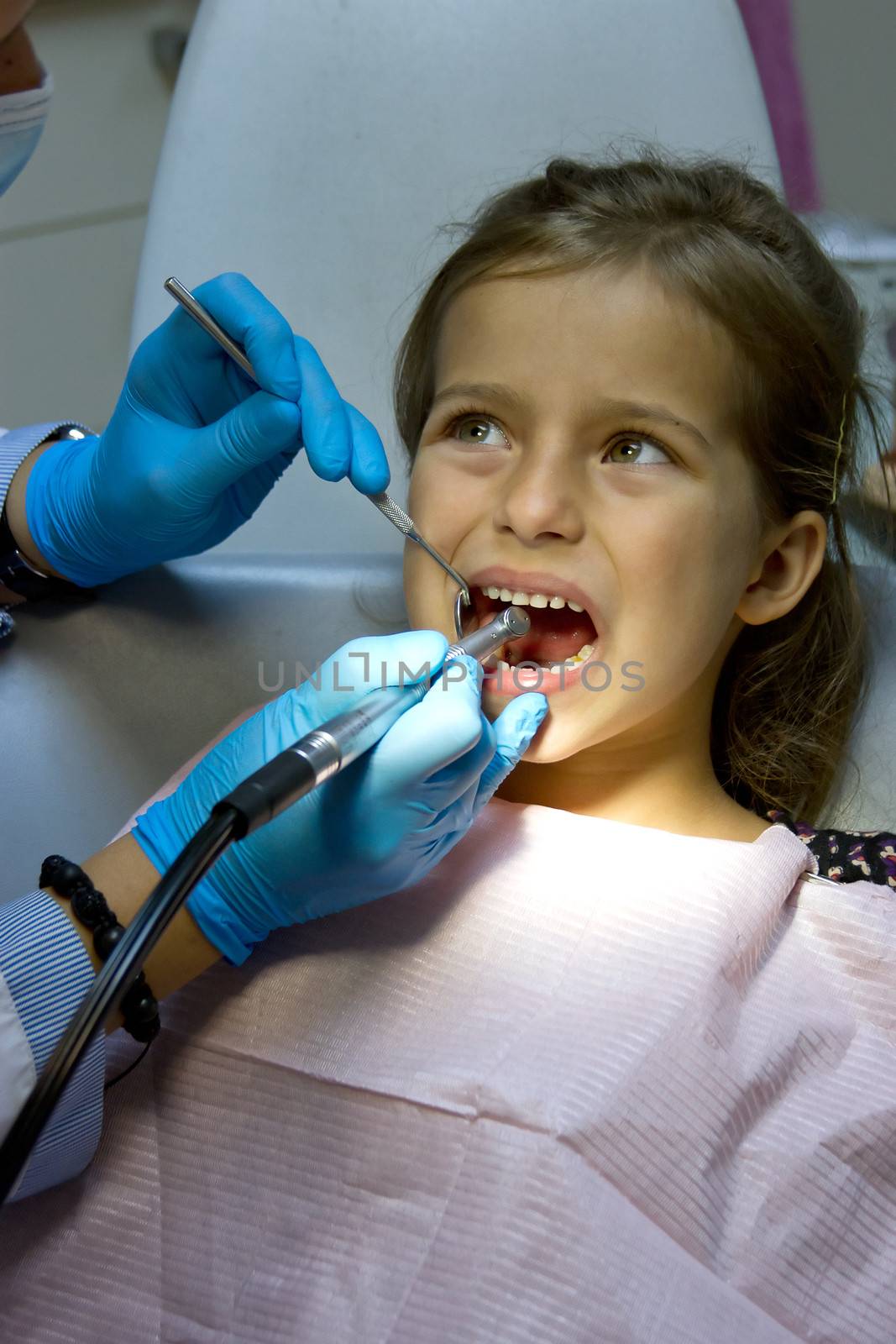 a girl at the dentist.