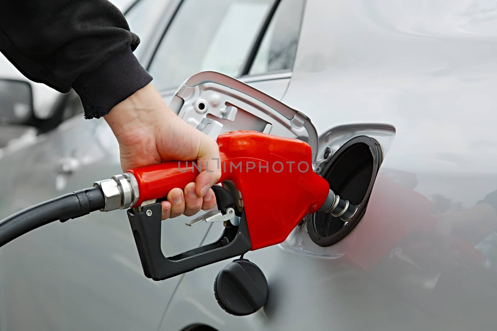 Fuel nozzle with hose isolated on white background