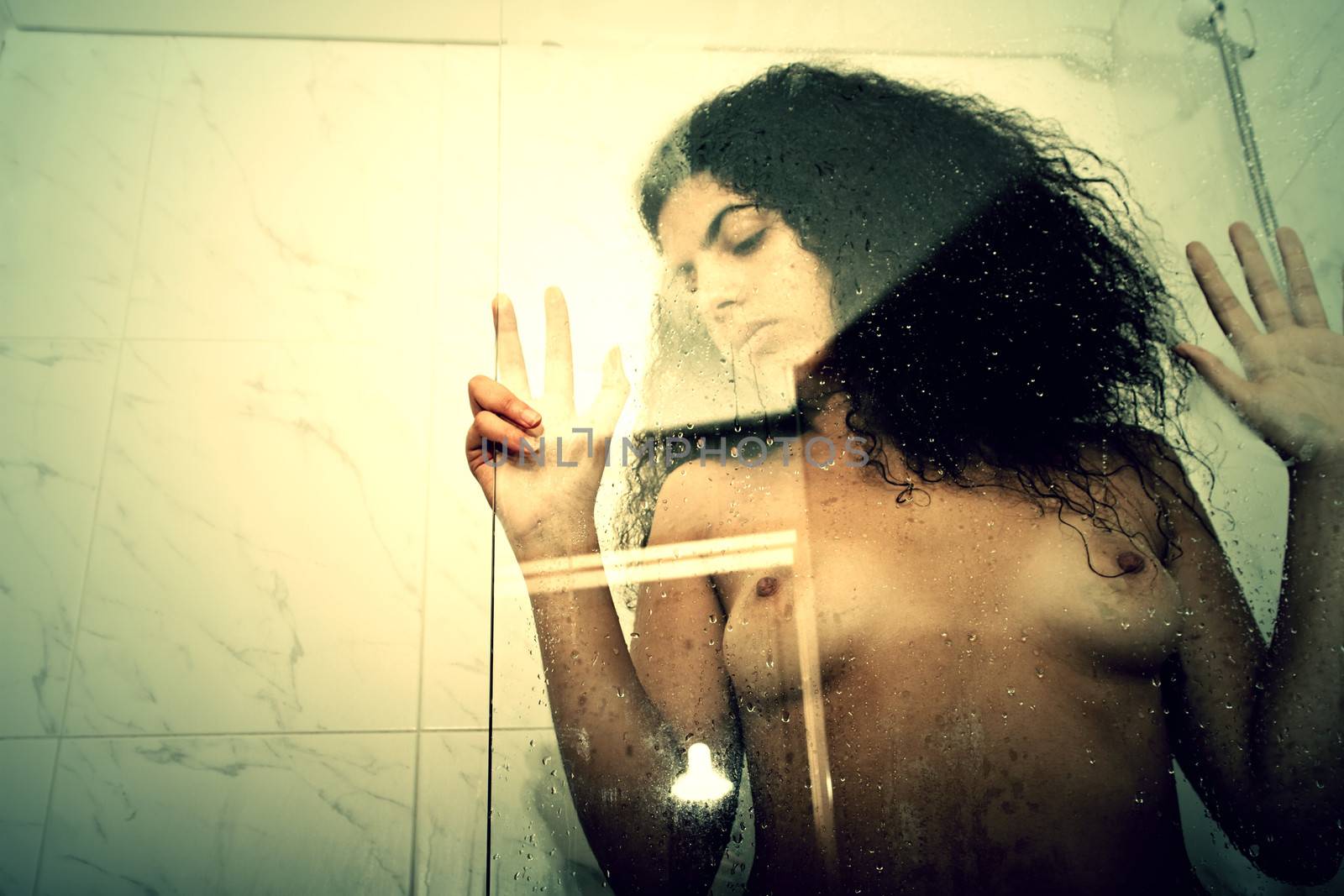 A young, brazilian woman under the shower.