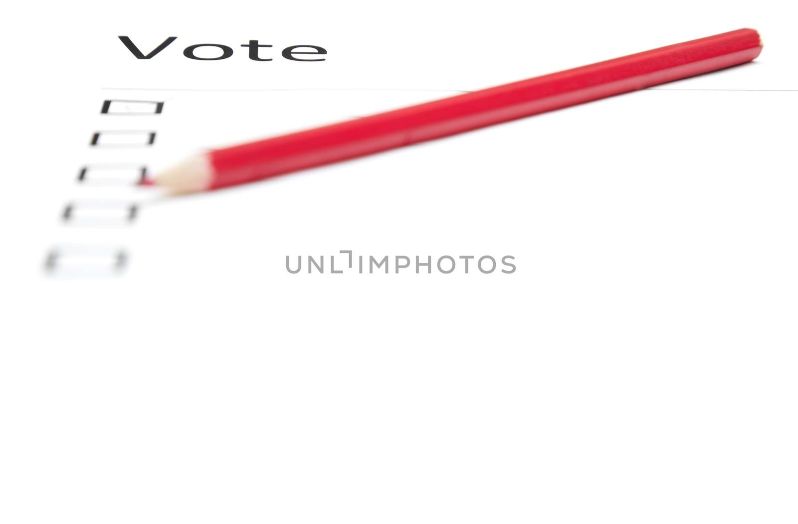 Voting bulletin with red pencil to make choice