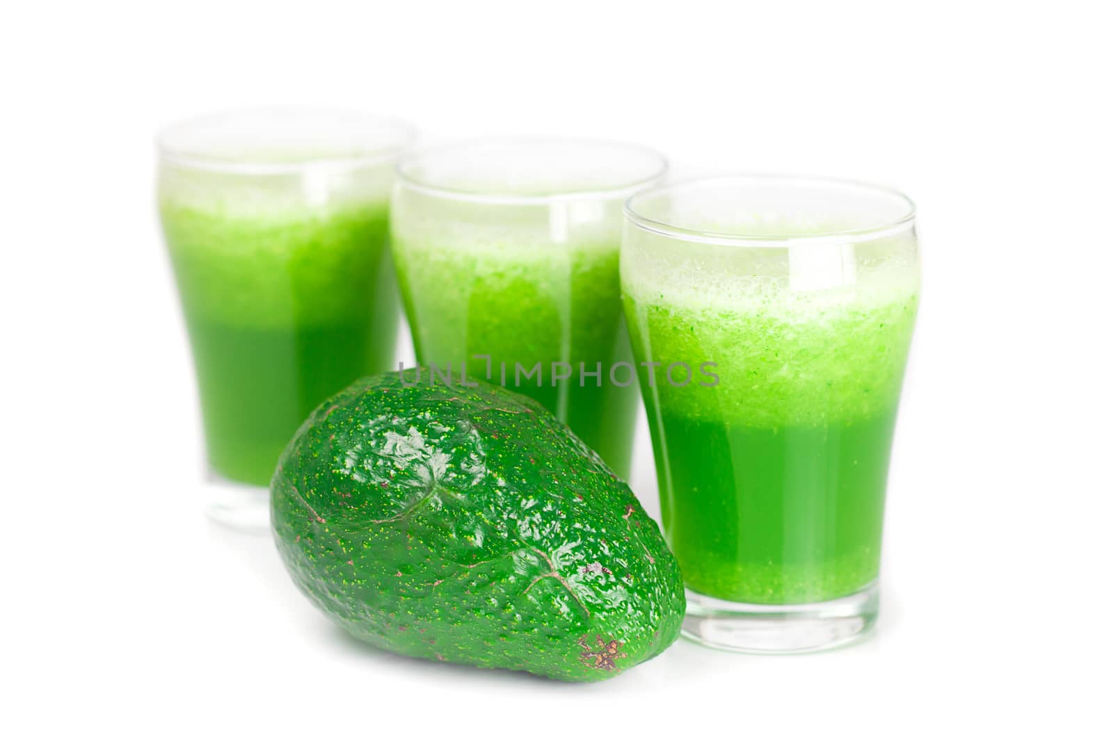 three glasses with celery juice and avocado isolated on white