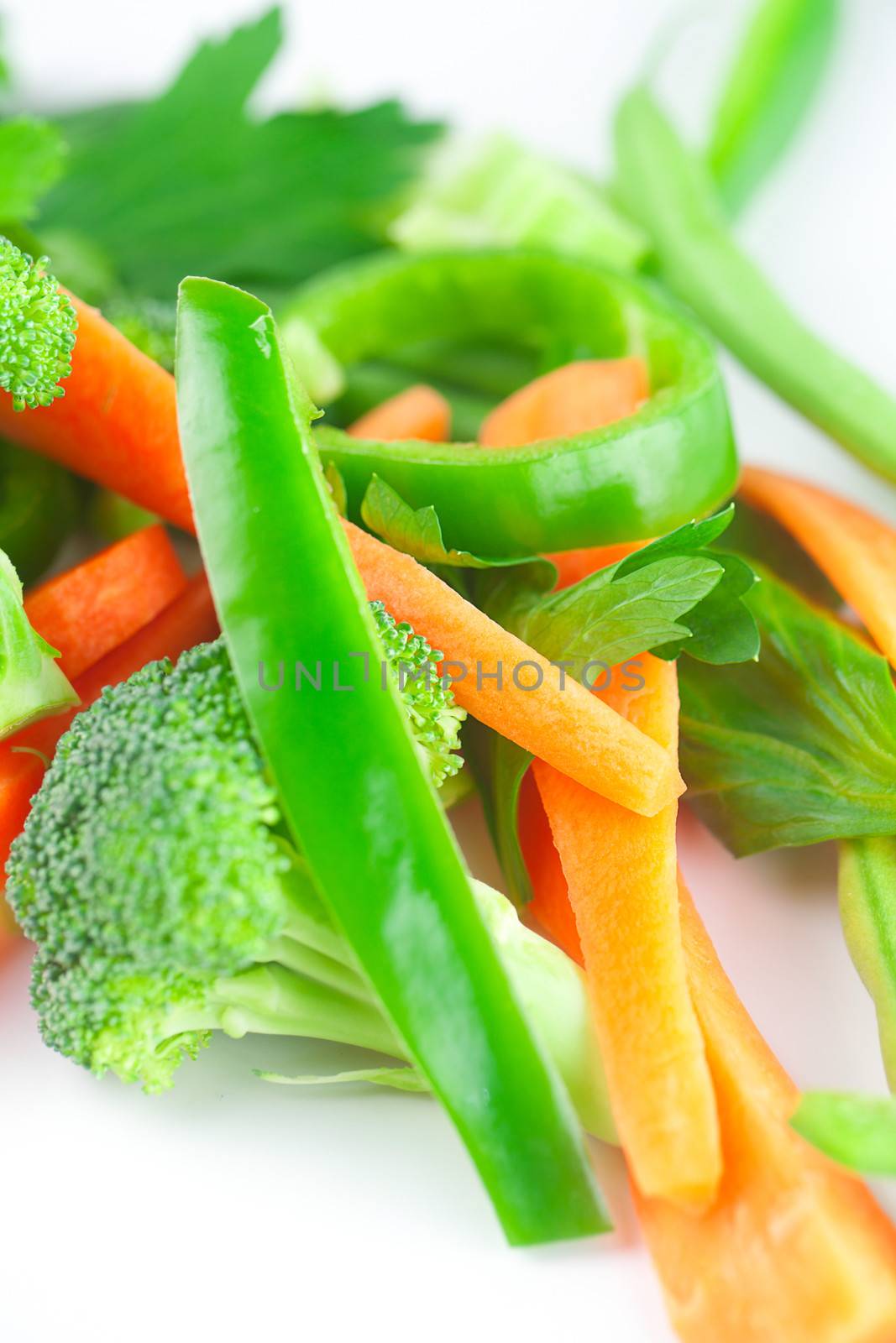 carrot, celery, broccoli and pepper isolated on white