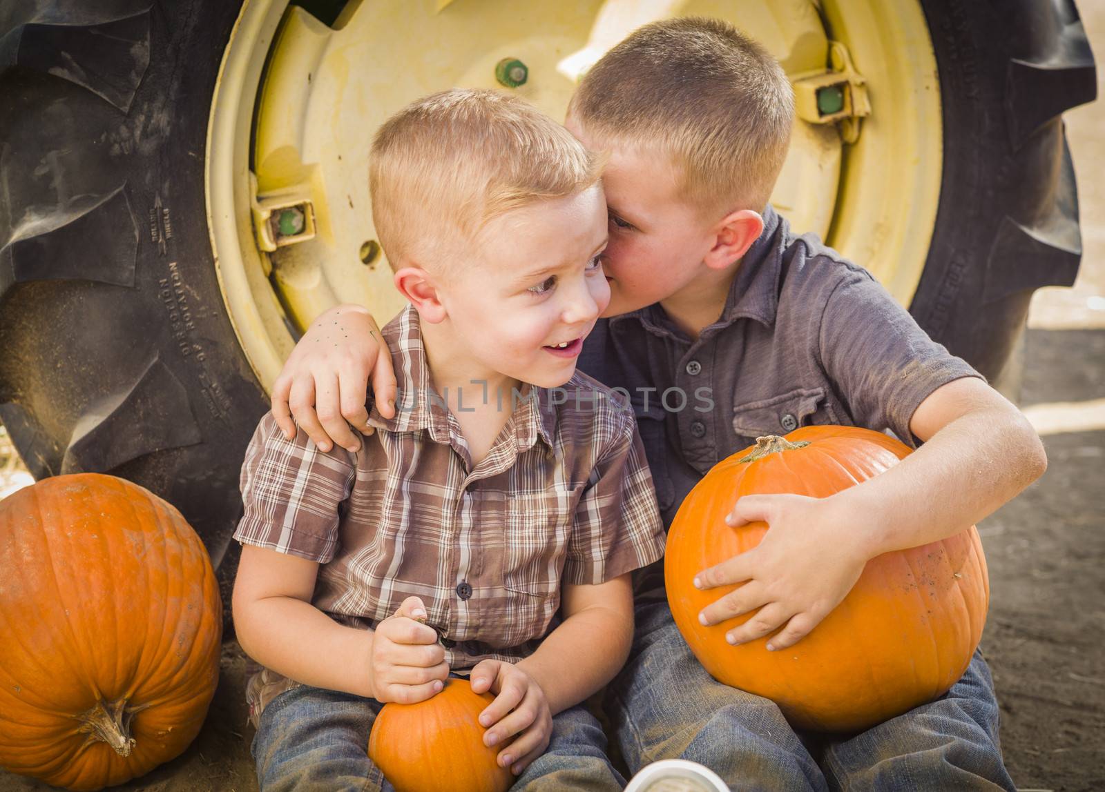 Two Boys Sitting Against Tractor Tire Holding Pumpkins Whisperin by Feverpitched