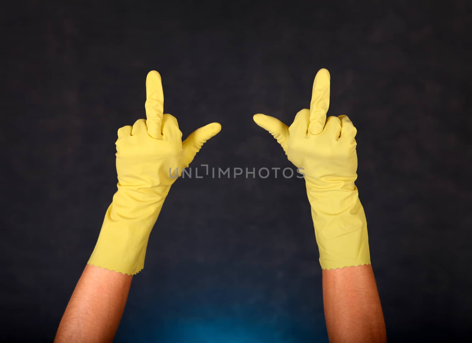 Two Hands in Rubber Gloves with Middle Finger gesture on the dark background