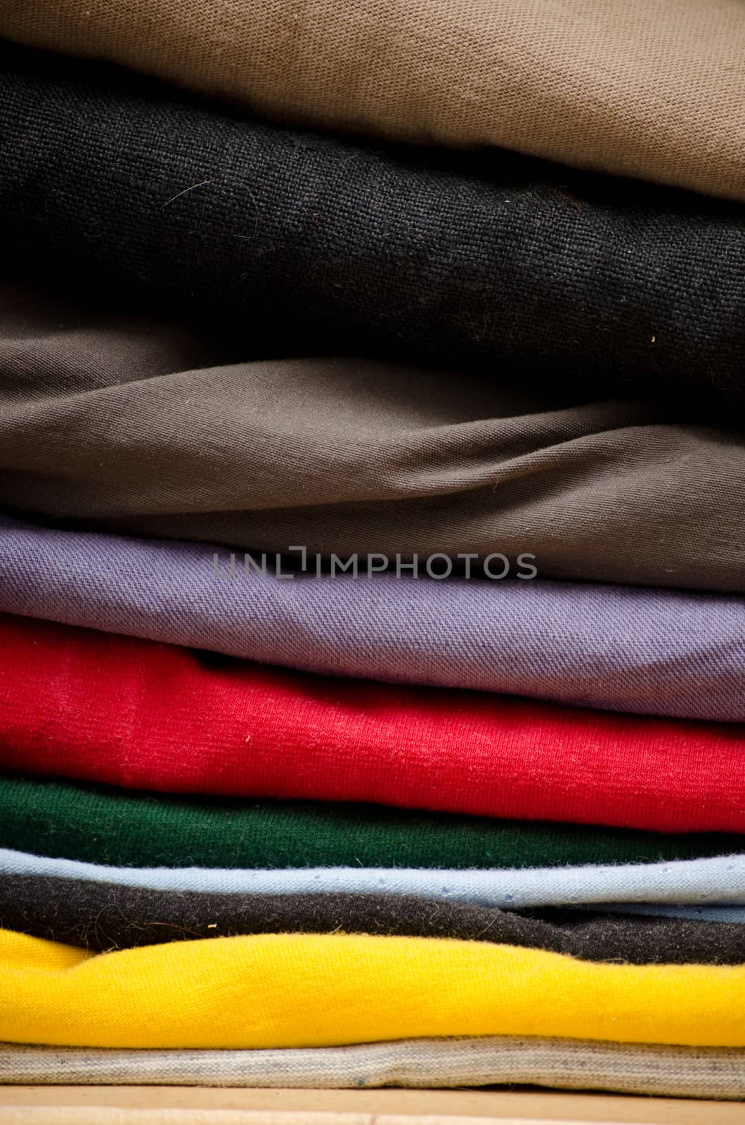 stack of clothes by sarkao