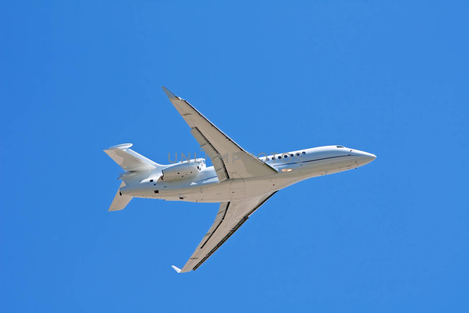 Business jet liner in the blue sky