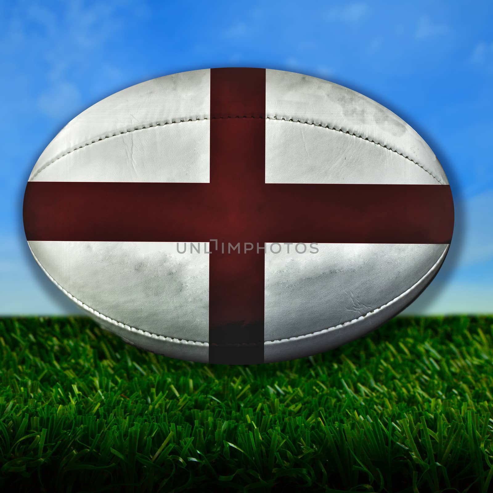 Rugby ball with England flag over grass