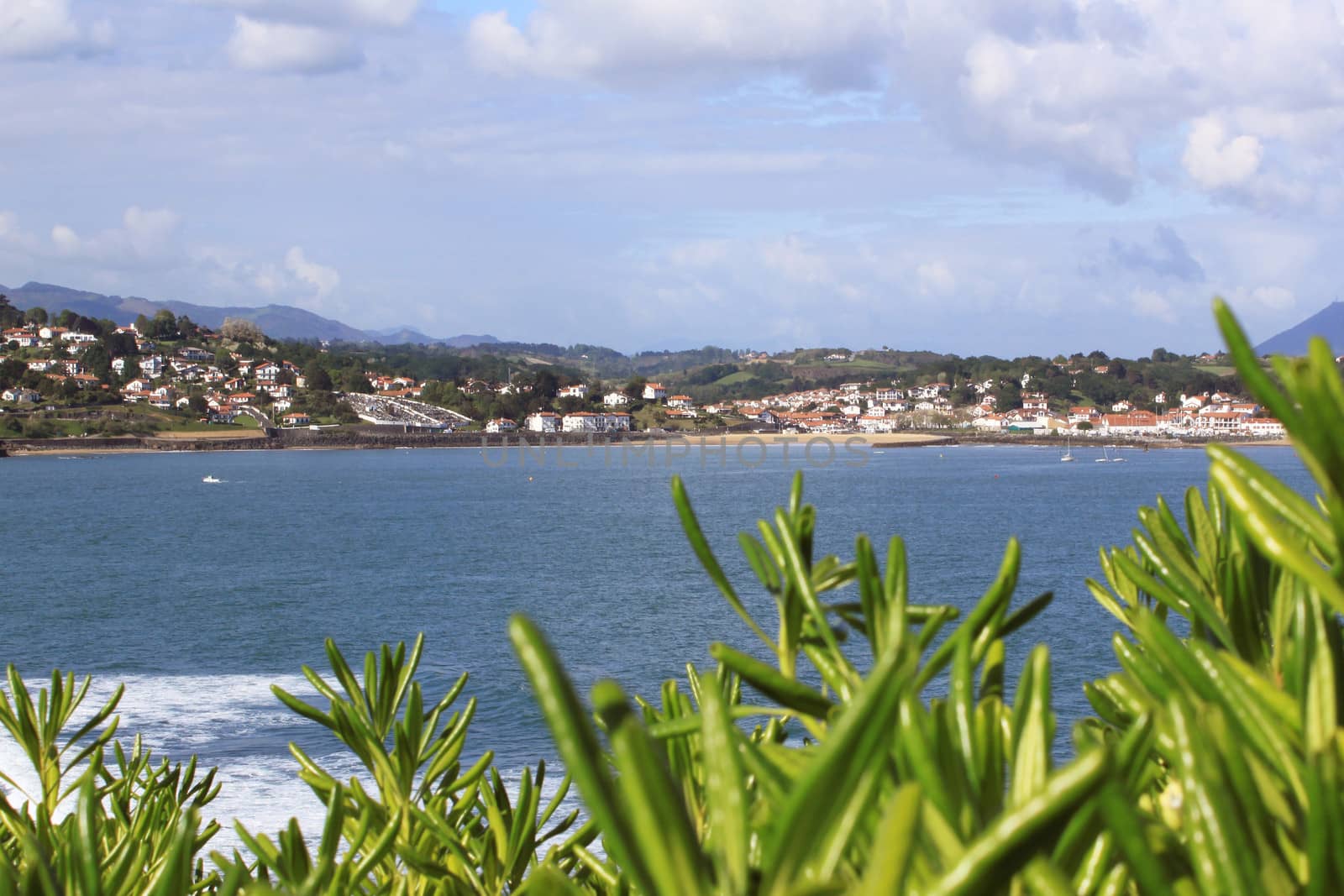 panorama of a coastal town by the sea with its beach and mountains