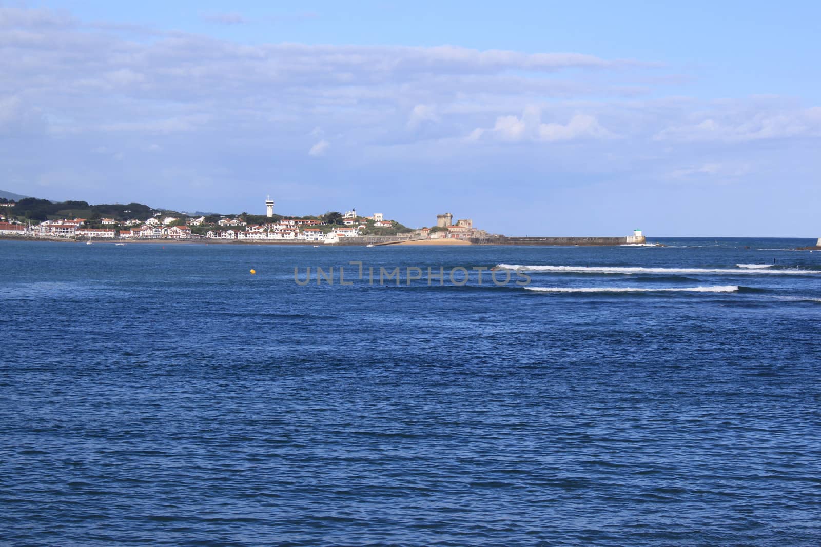 panorama of a coastal town by the sea with its beach and mountains