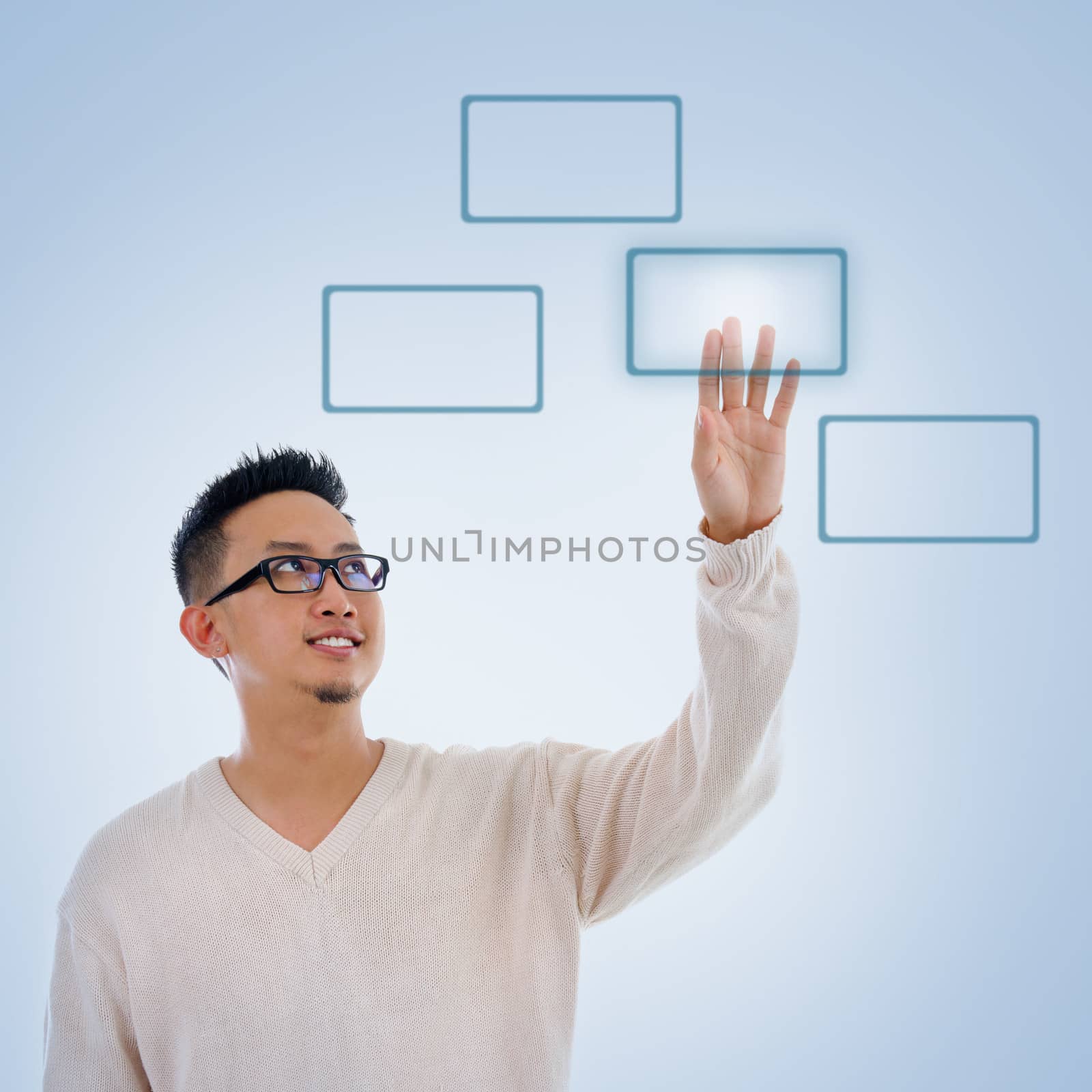 Asian man finger pressing on touch screen monitor button, isolated on blue background. Asian male model.