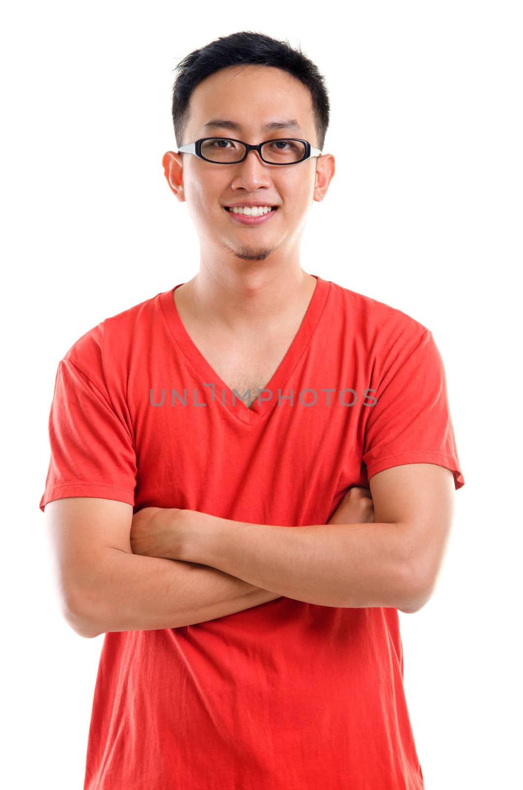 Portrait of young casual Southeast Asian man arms crossed isolated over white background