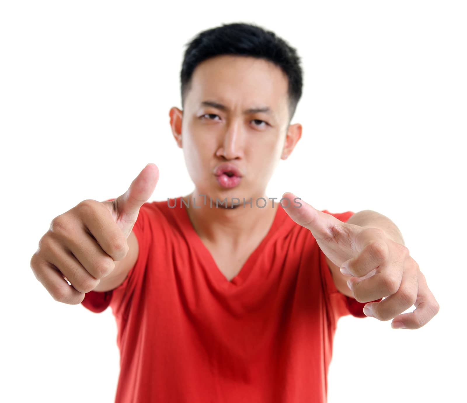 Thumbs up young Southeast Asian man isolated over white background