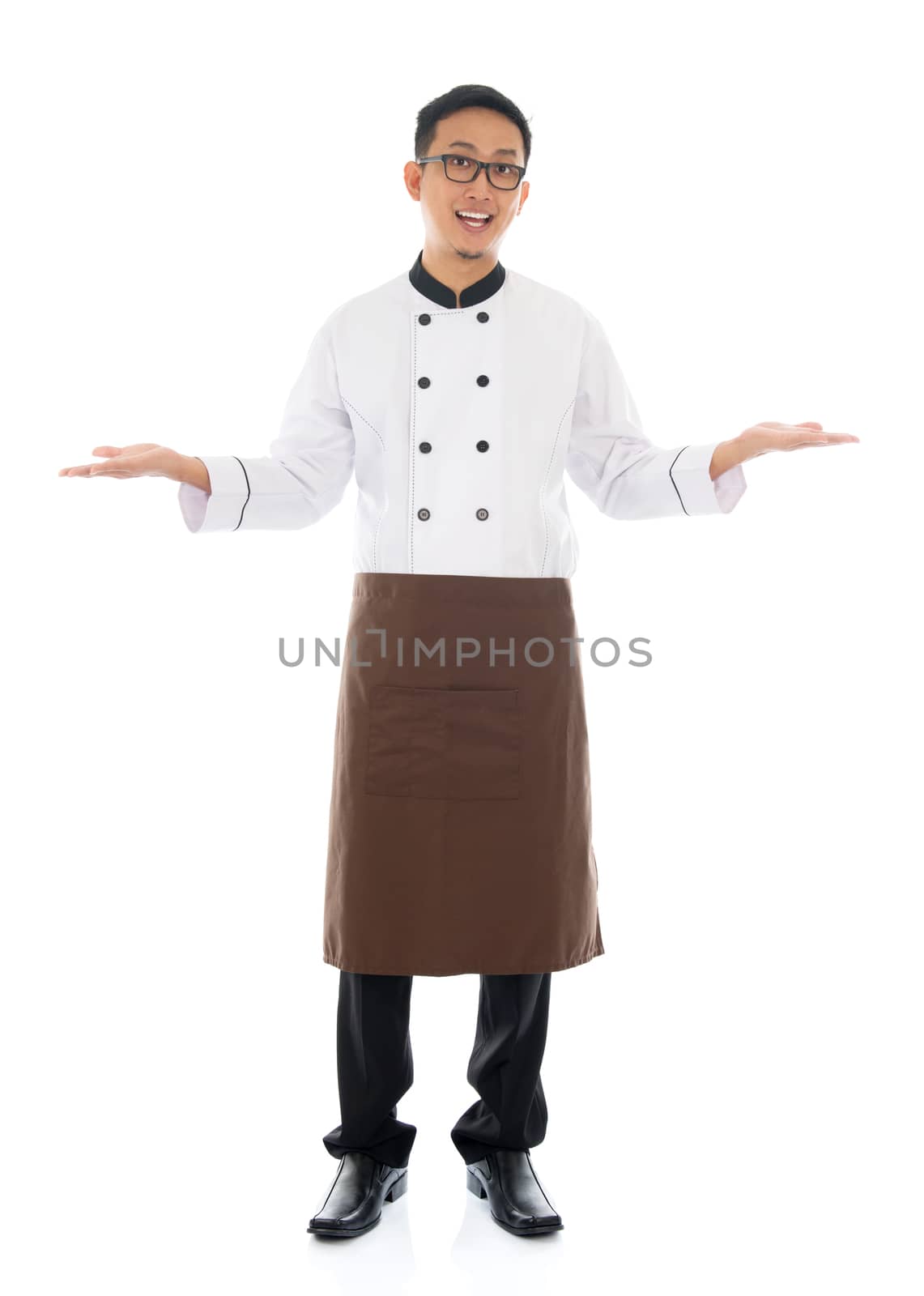 Full body Asian male chef hands showing blank space, welcome guest concept, standing isolated white background.