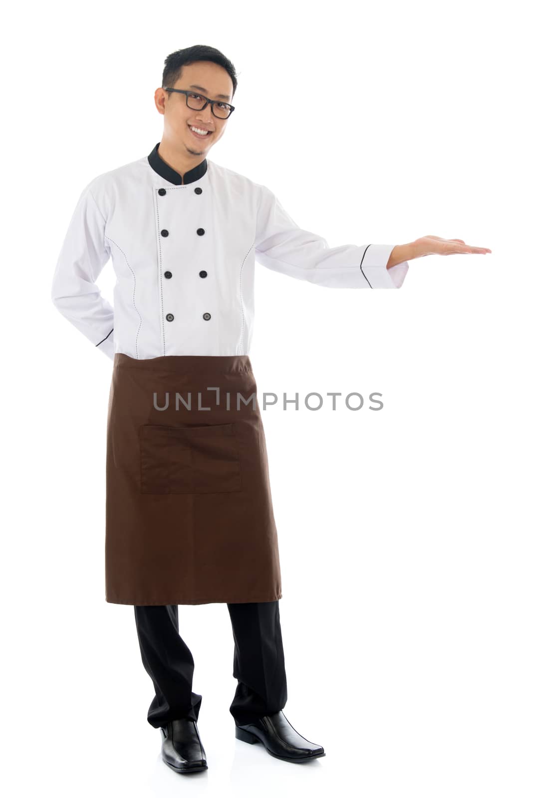 Full body Asian male chef hand showing blank space, standing isolated white background.