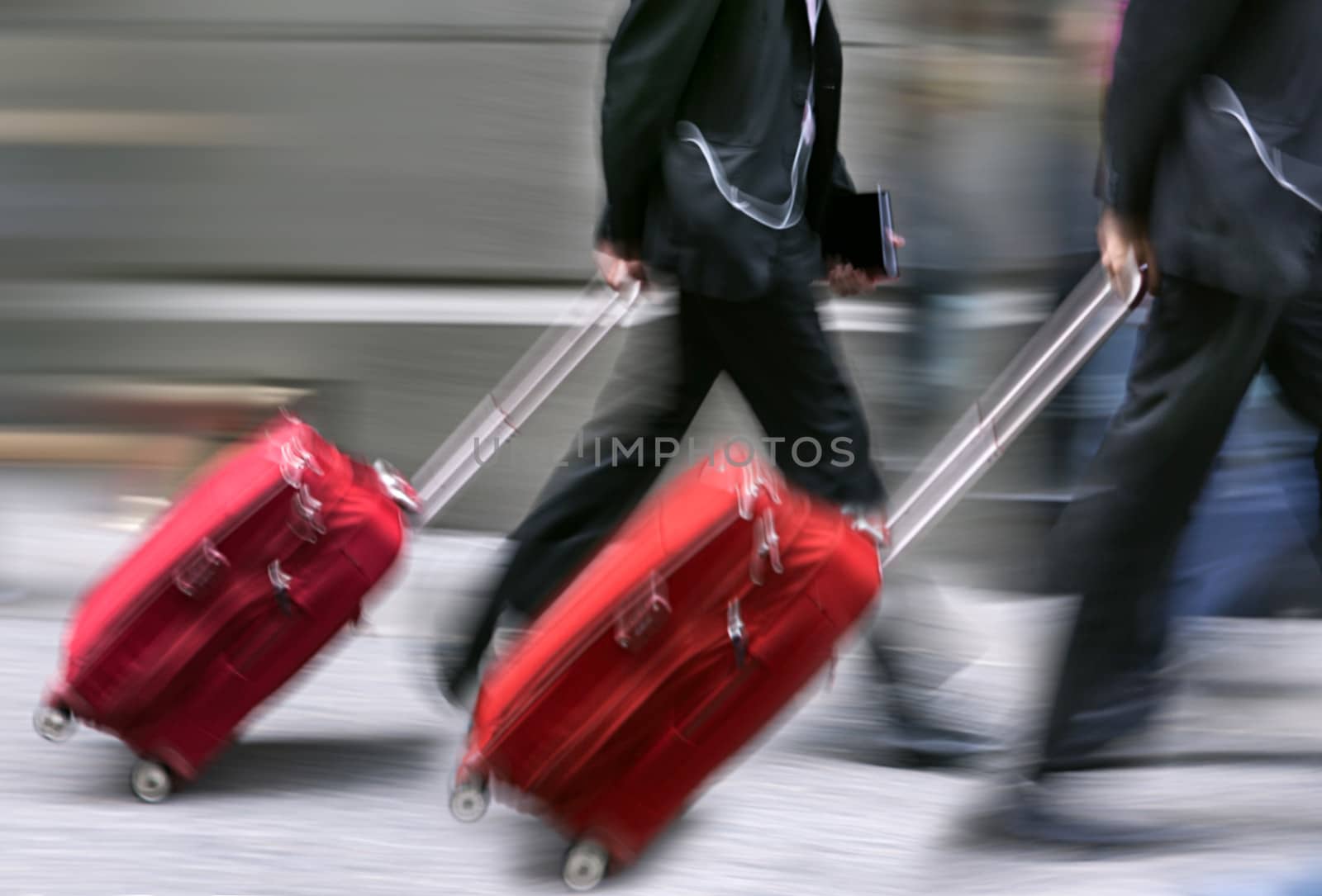 Sale. People with suitcases in a hurry. Intentional motion blur