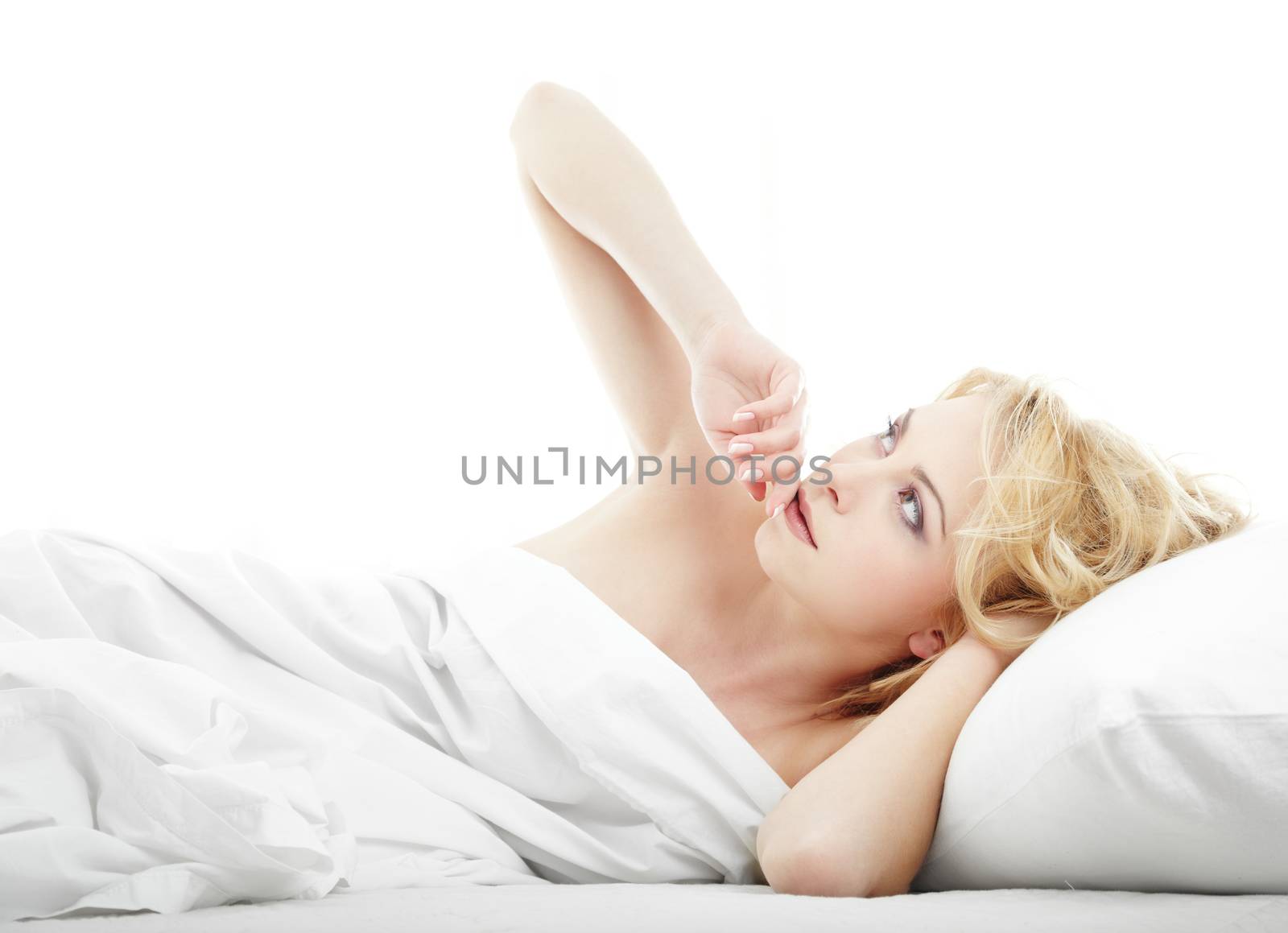 Serene lady thinking and laying on the bed