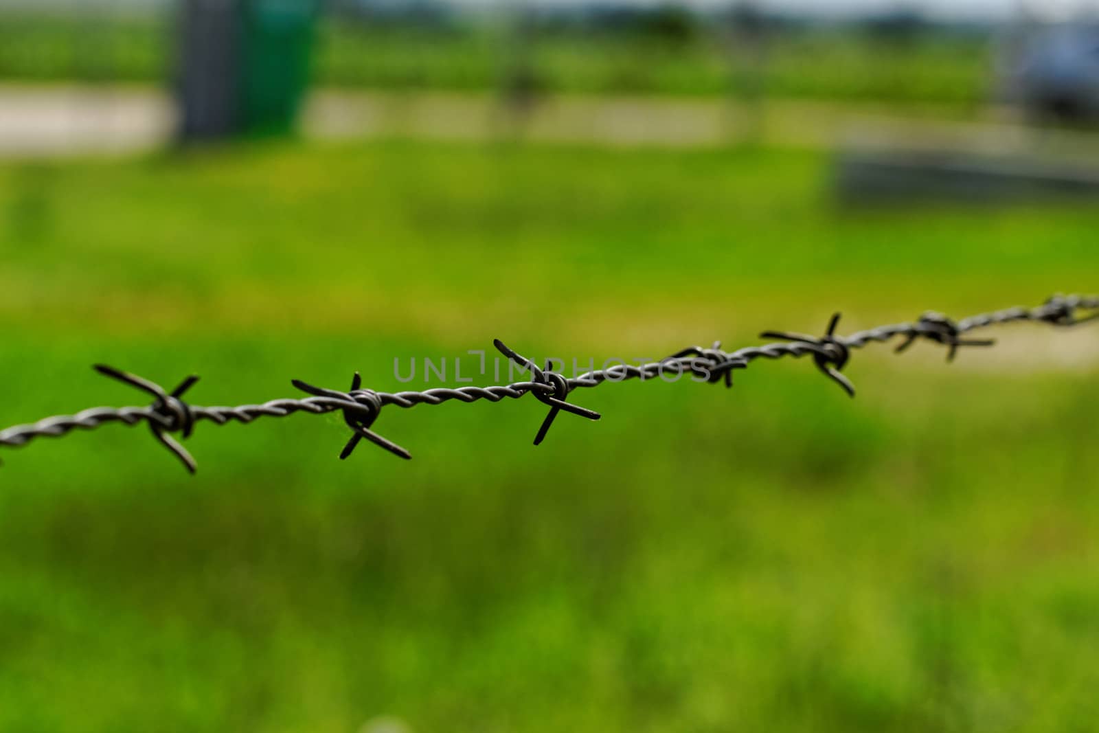 barbed wire defending the industries