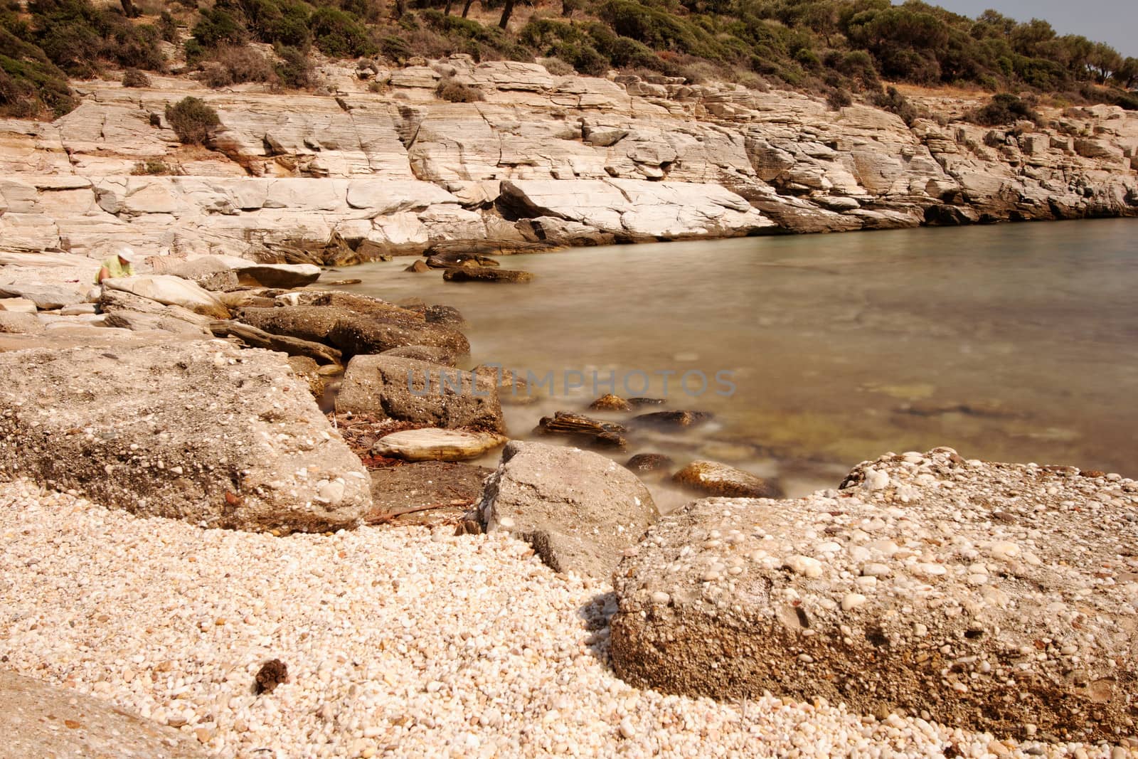rocky beach with turquoise sea in greece thassos island