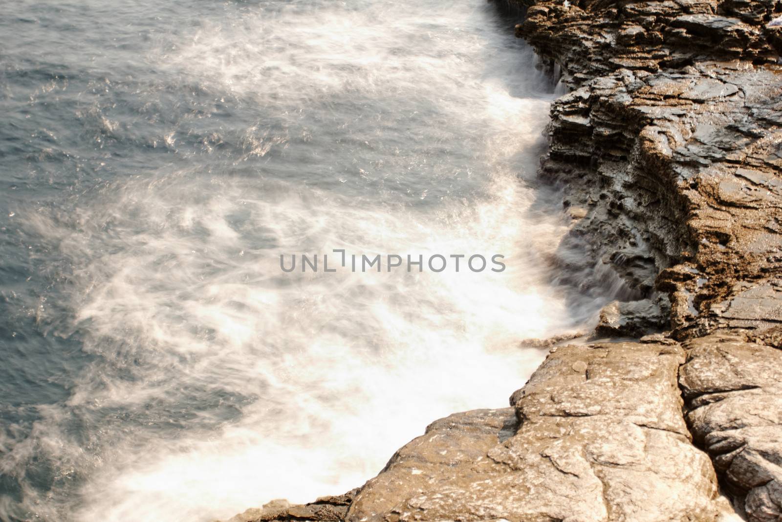 the rocky beach breaks the huge waves