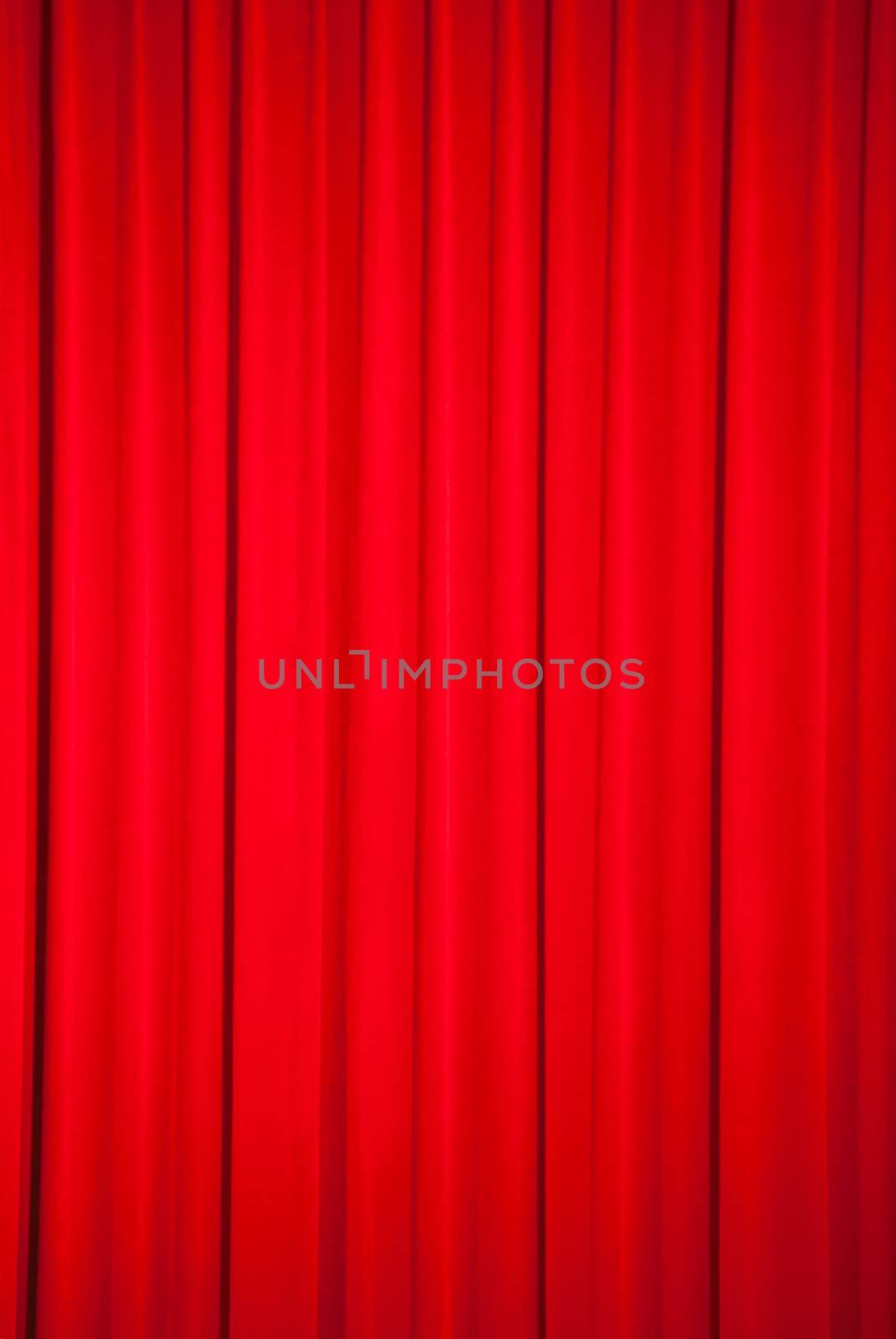 Brightly lit red curtains for background