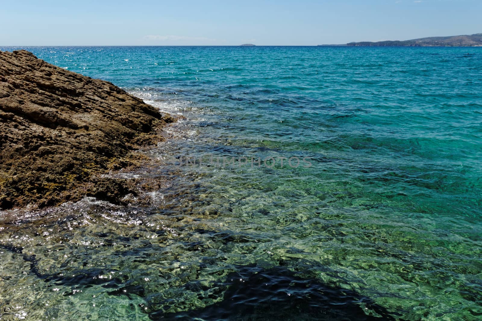 rocky beach with turquise sea on greece thassos island