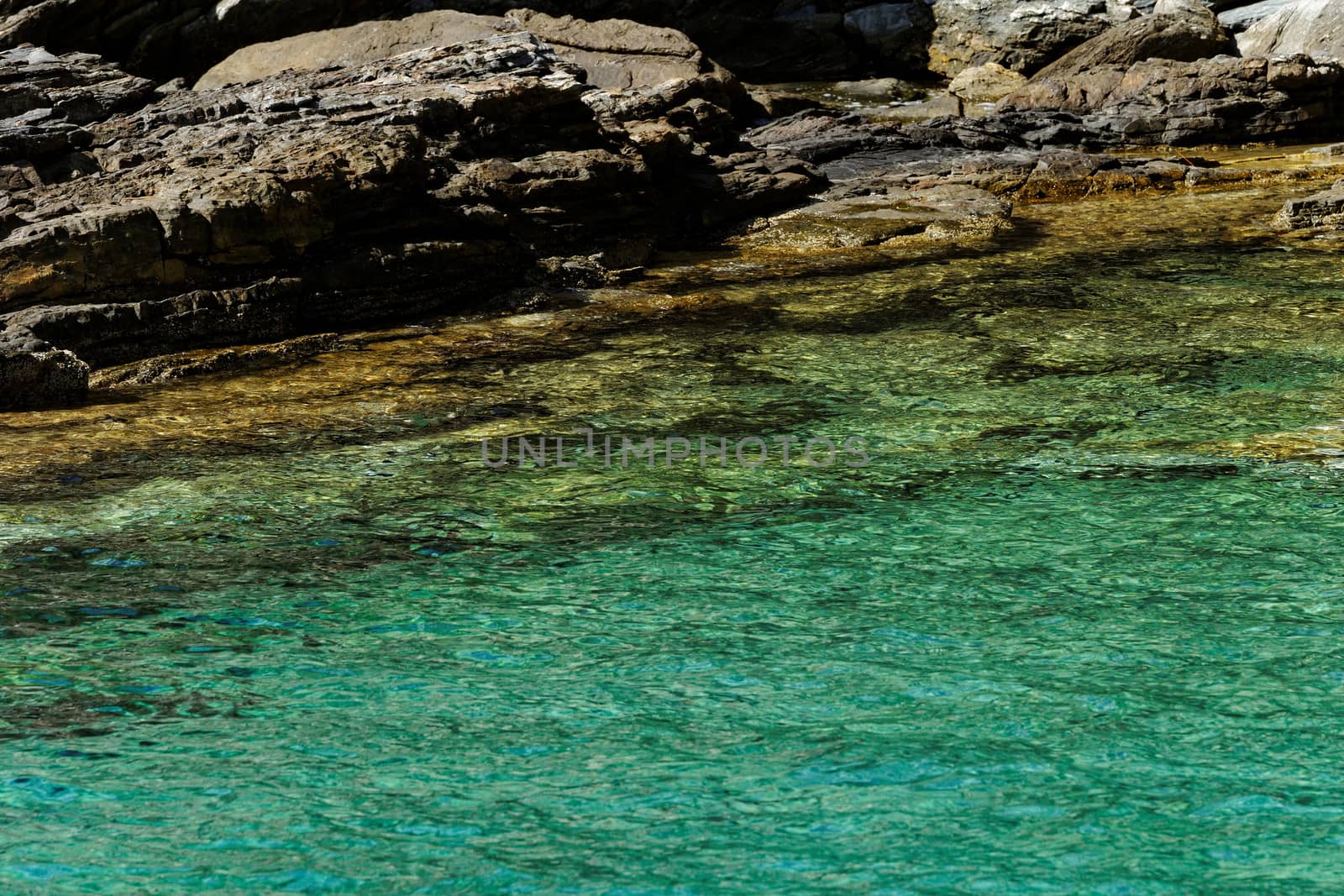rocky beach with turquoise sea in greece thassos island