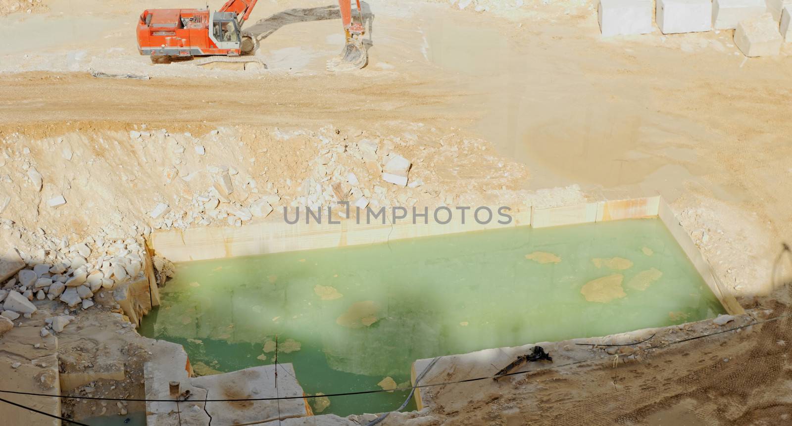 Detail of huge Thassos white marble quarry (mine) with grabber