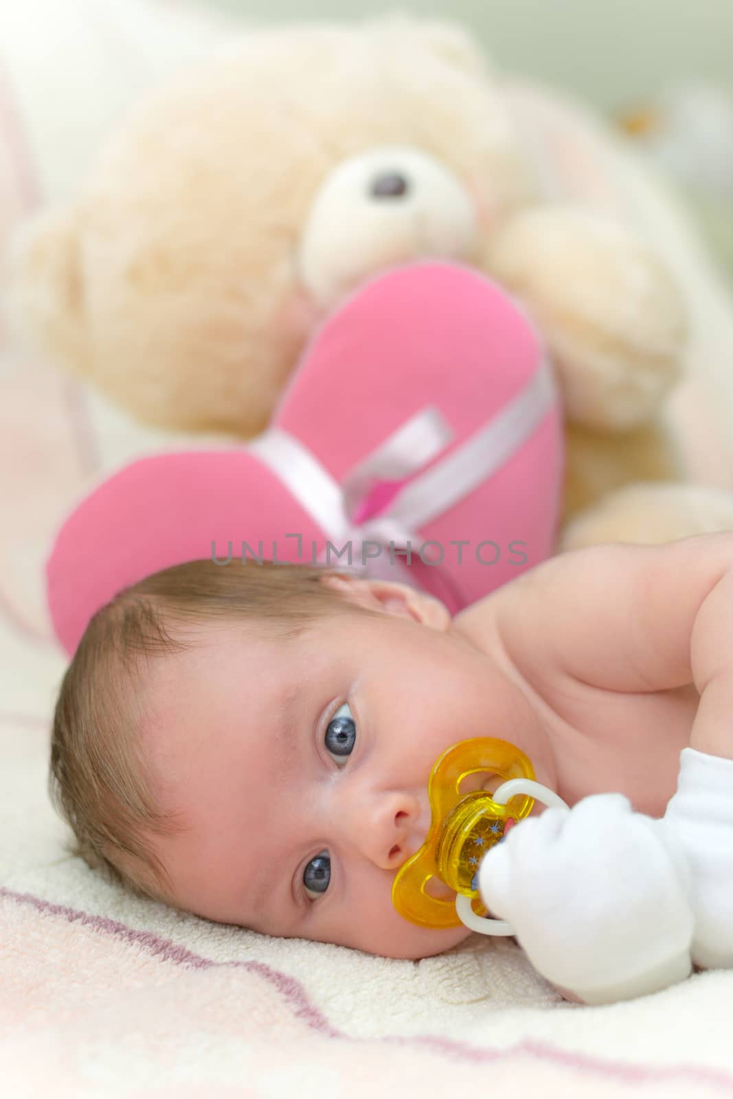 Infant baby (1 month old) lying on bed by only4denn