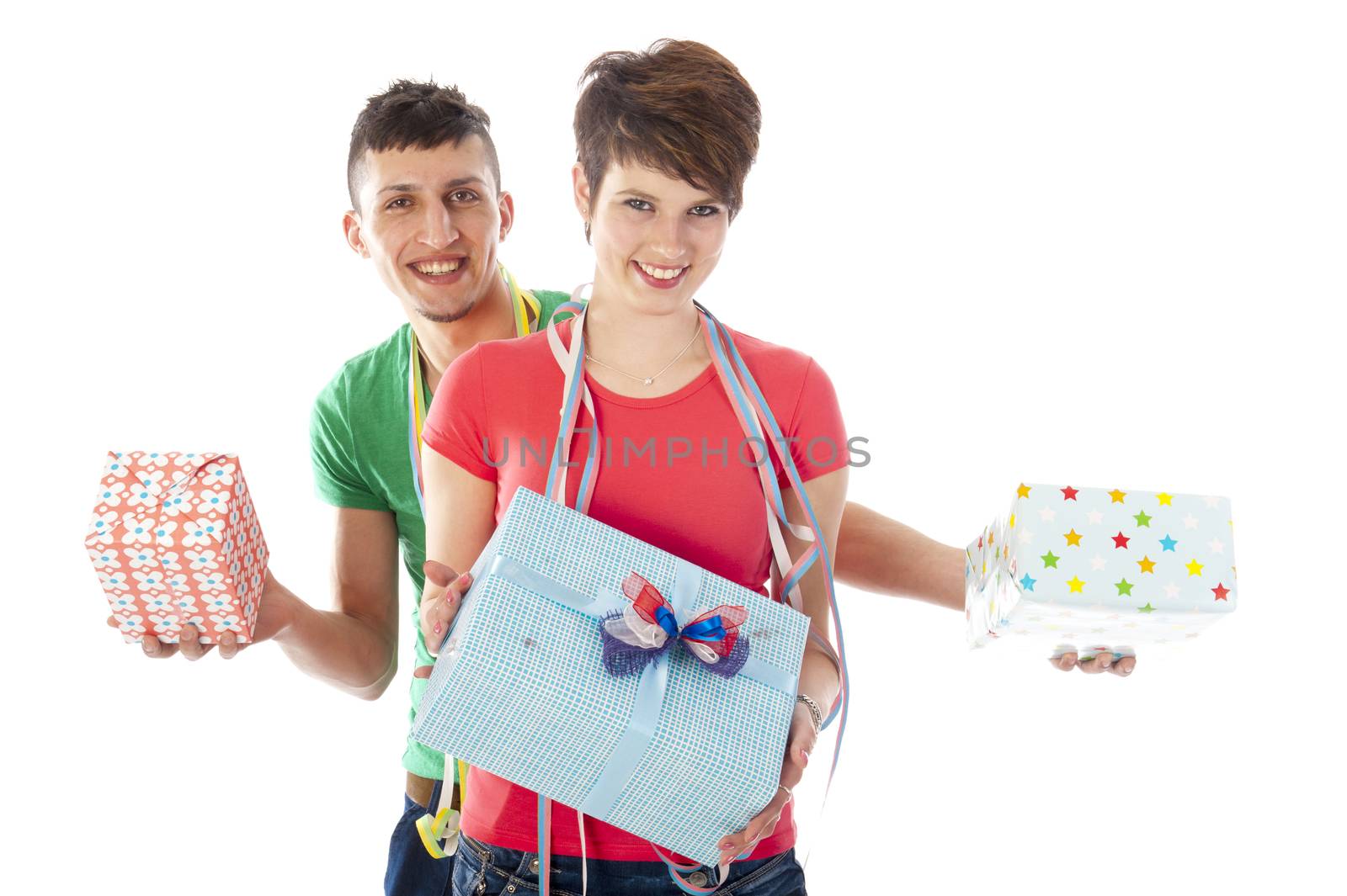 a birthdayboy and a birthdaygirl with a lot of presents an a birthdaycake