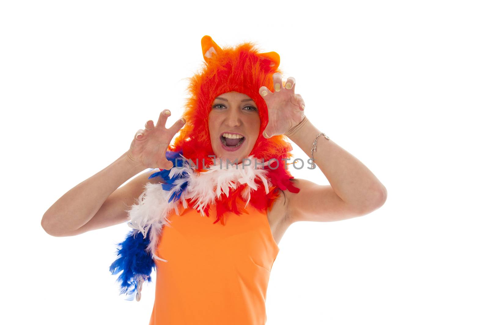 a girl, dressed as an orange lion, like a supporter of the dutch soccer team