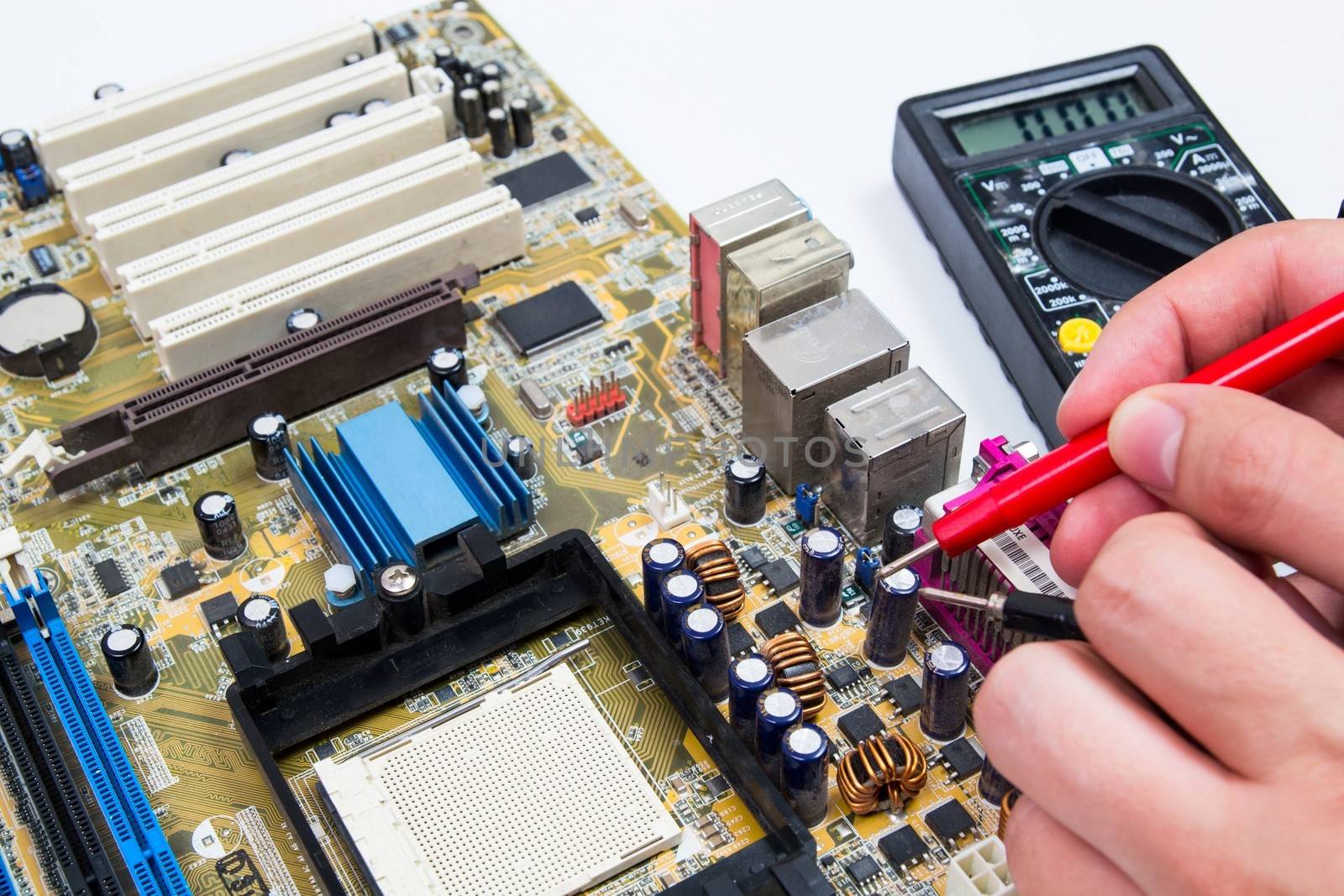 Motherboard measure. Man repairing computer hardware  by simpson33