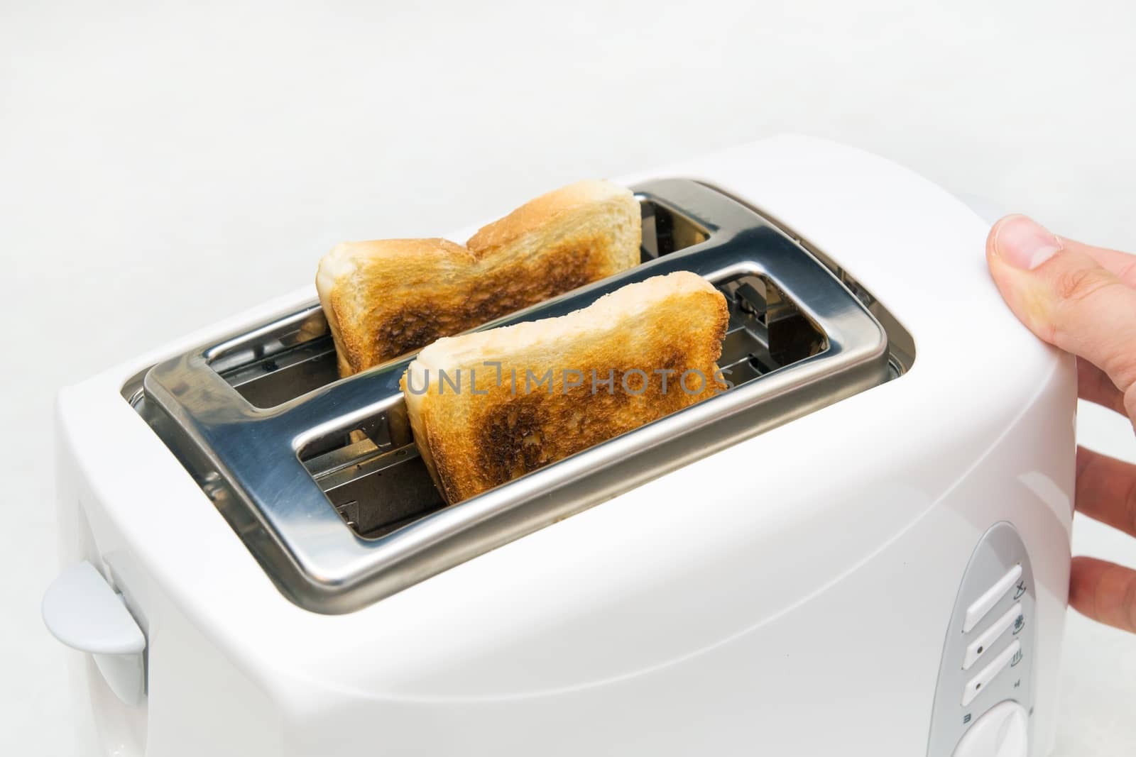 Toaster with bread slices on white background by simpson33