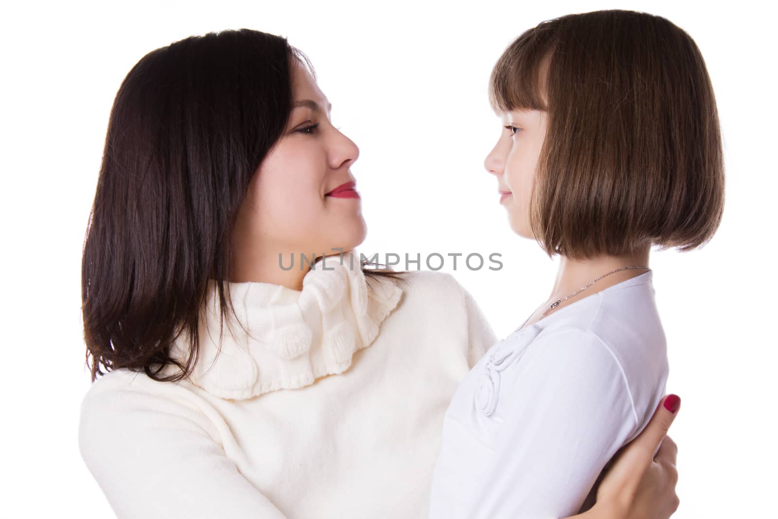 Mother and daughter face to face isolated on white