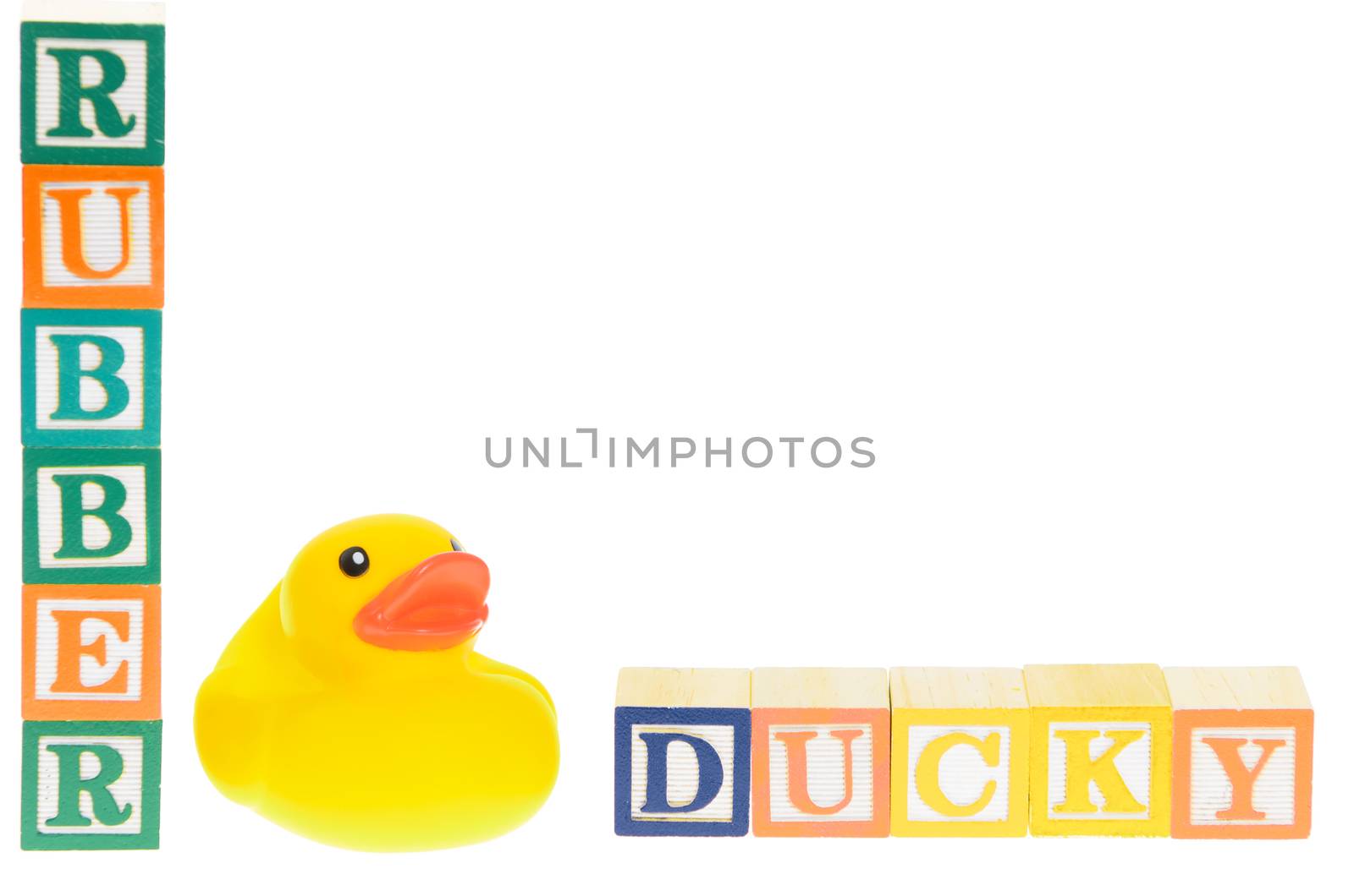 Baby blocks spelling rubber ducky with a rubber duck. Isolated on a white background